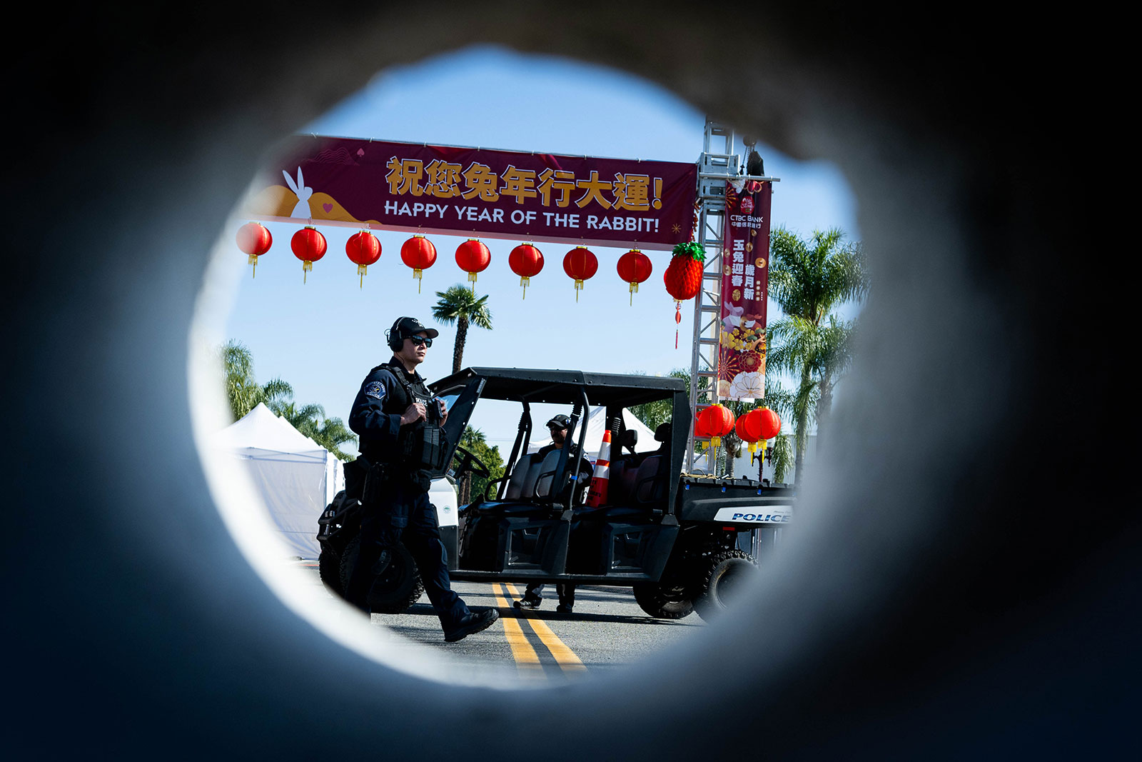 Monterey Park Police stand guard at the closed Lunar New Year festival site on Sunday, January 22 after a mass shooting at Star Ballroom Dance Studio Saturday night. 