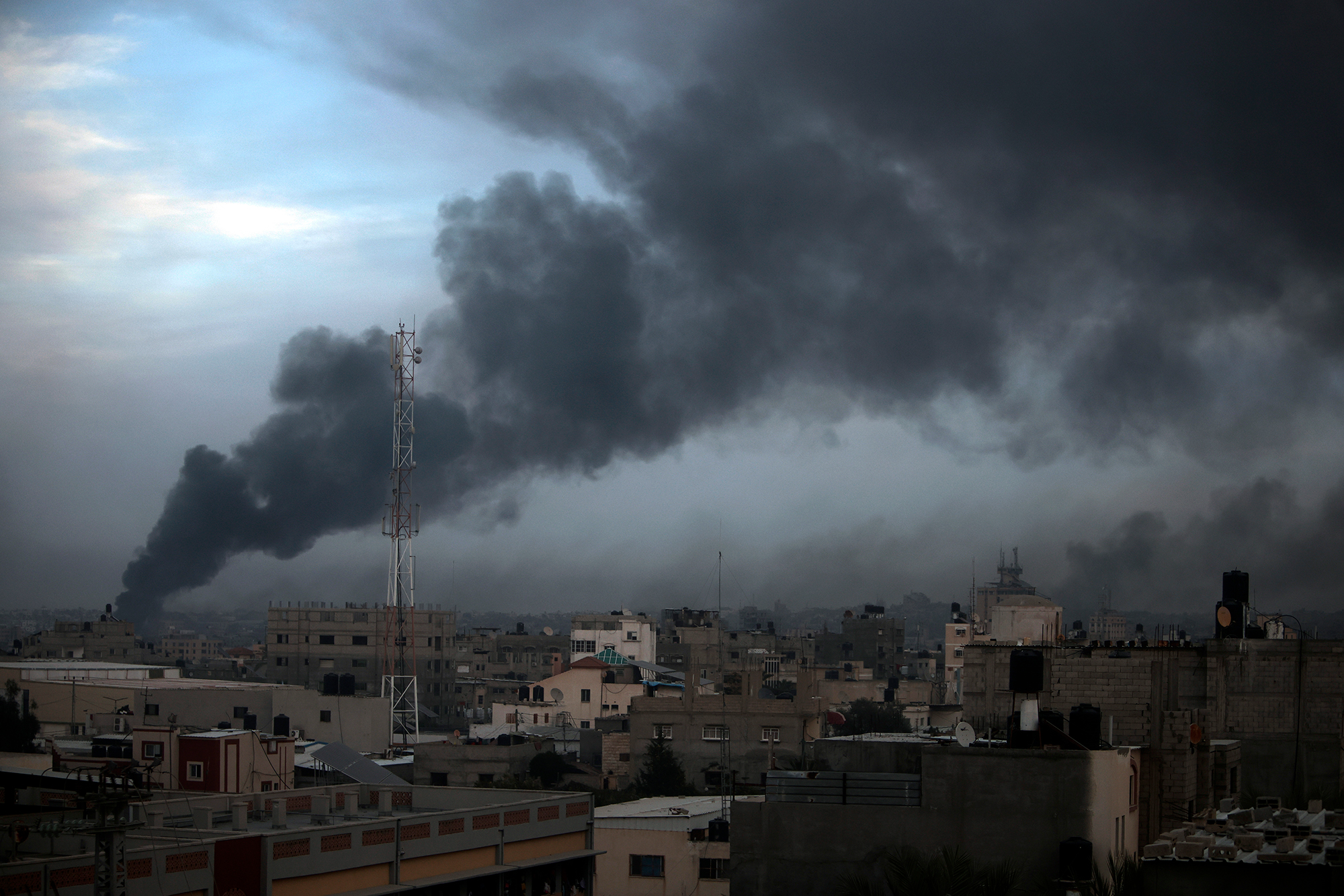 Smoke rises over Khan Younis, Gaza after Israeli strikes on Sunday, December 10. 