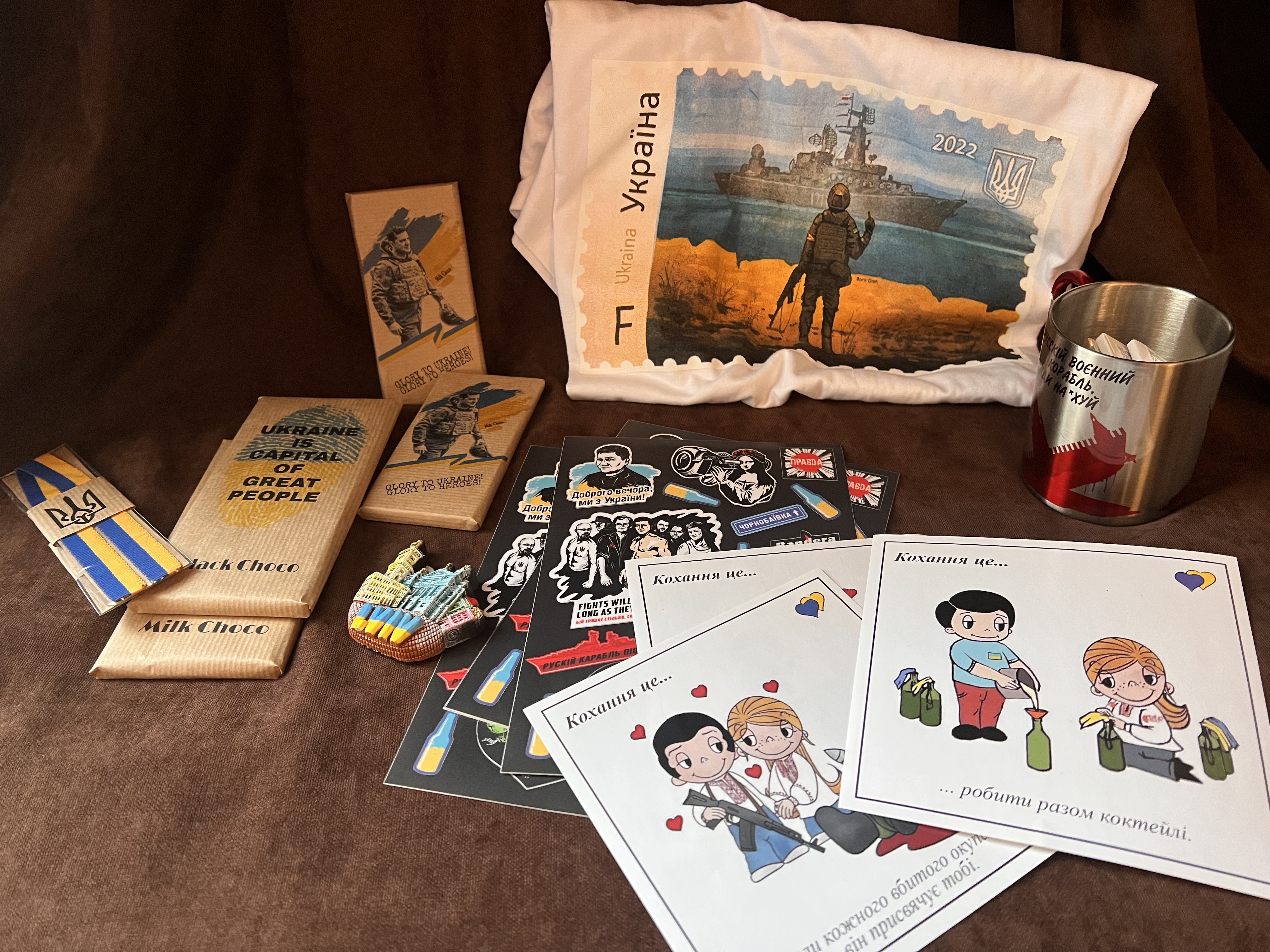 Chocolate with Ukrainian President Volodymyr Zelensky's image, a T-shirt featuring the Snake Island postage stamp and cards with a couple making a Molotov cocktail are available in a Lviv tourist shop.