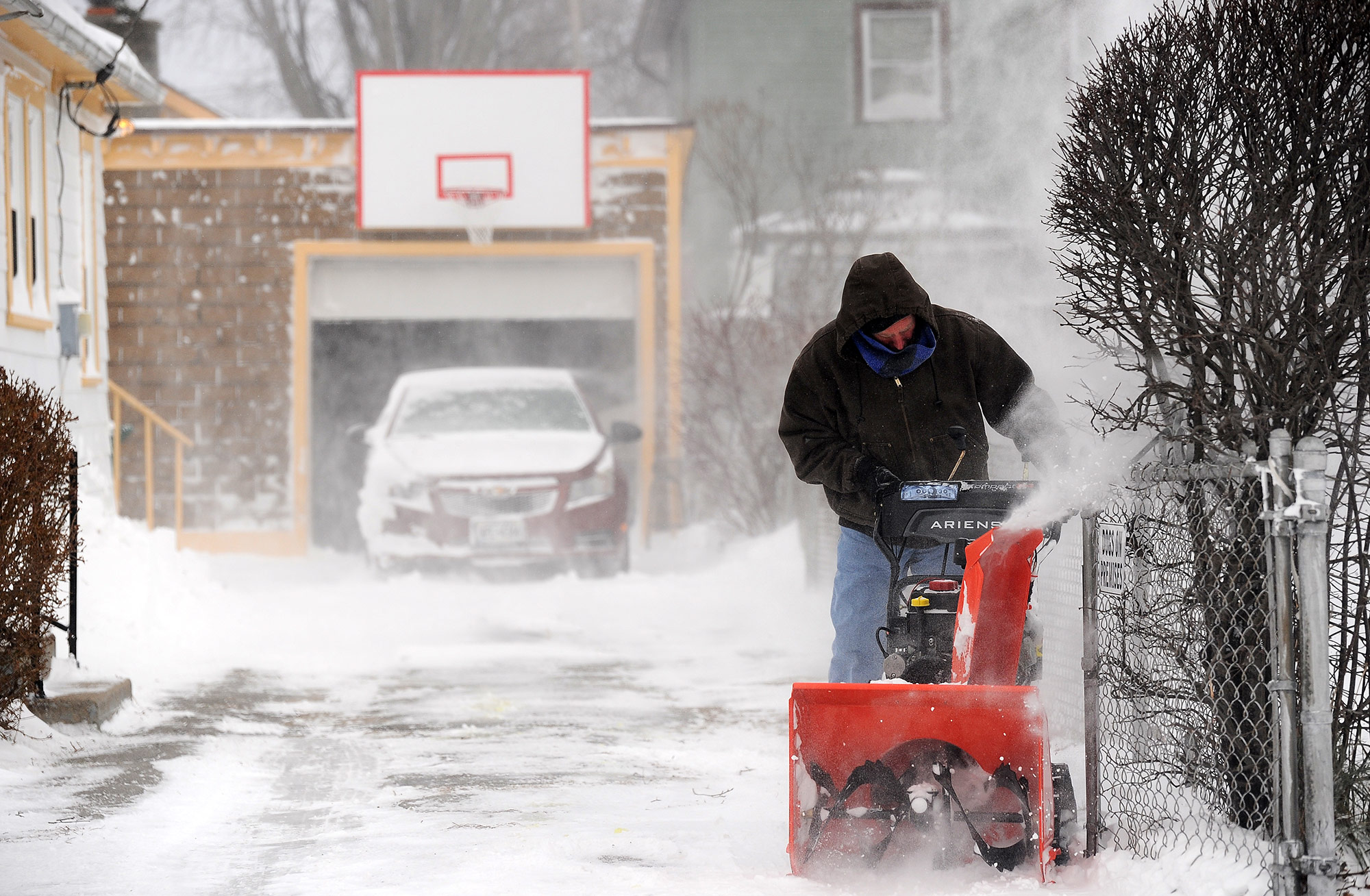 Paul Lamb clears his driveway on December 24, in Hamburg in Erie County, New York. 