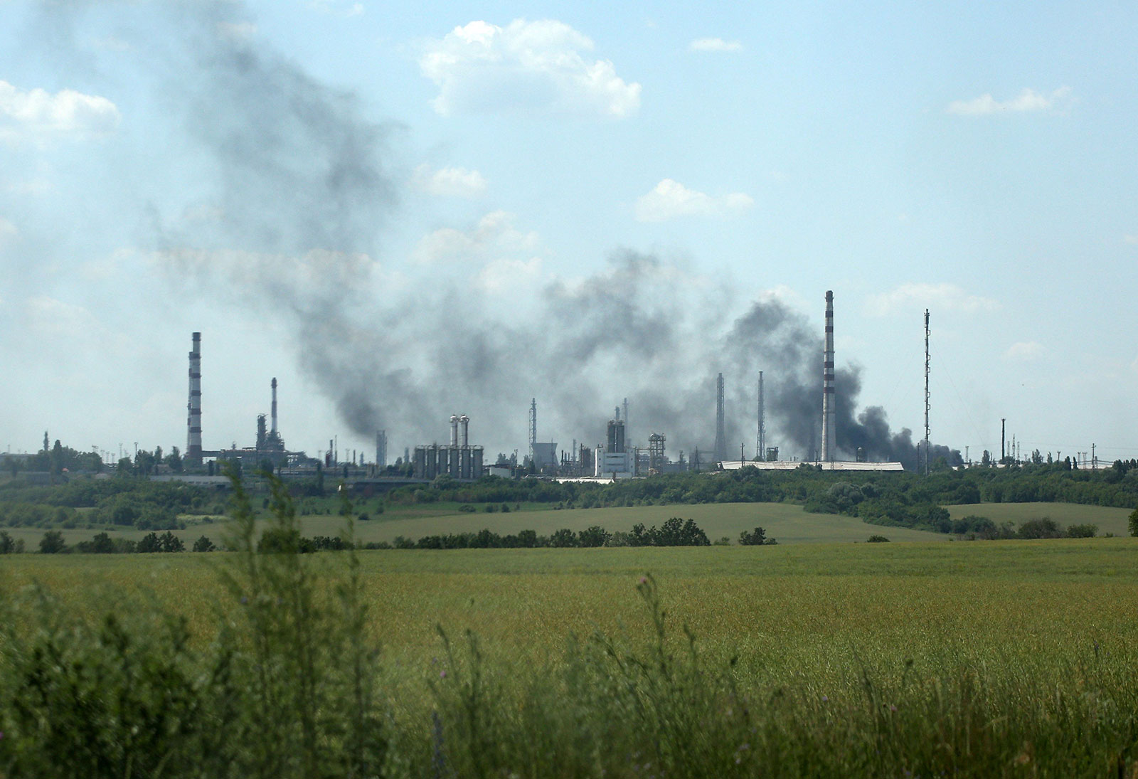 Smoke billows over the oil refinery outside Lysychansk on June 21.
