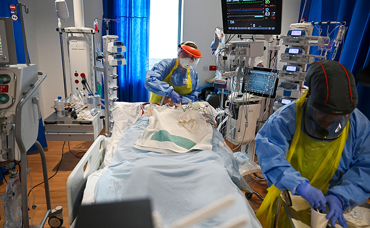 Clinical staff wear personal protective equipment as they care for a patient in the Intensive Care unit  at the Royal Papworth Hospital, in Cambridge, U.K., on May 5. 