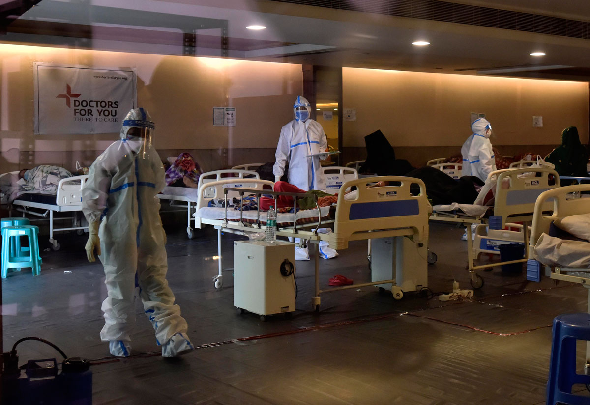 Health workers take care of Covid-19 patients at Shehnai banquet hall, which has been converted into a Covid care center in New Delhi, India on April 13.