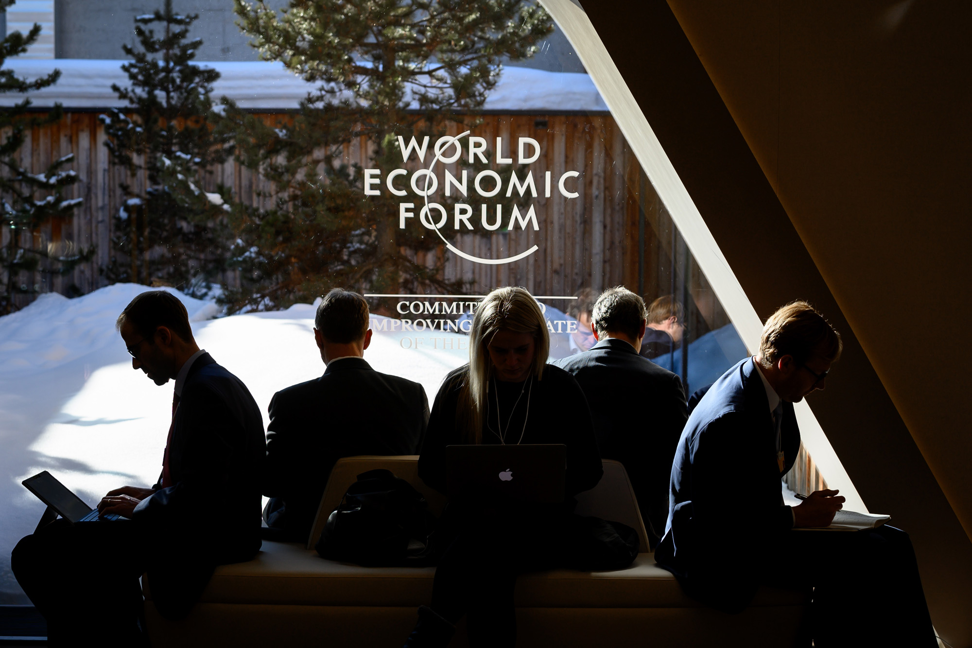 Participants sit near a window during the World Economic Forum annual meeting in Davos, on January 23.