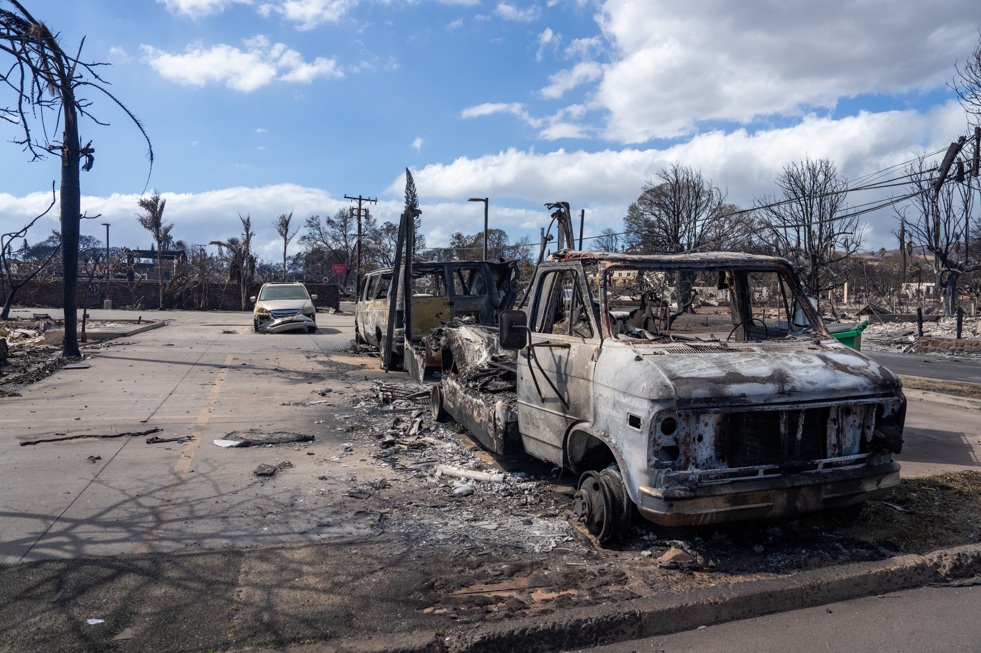Burned cars sit after wildfires raged through Lahaina, Hawaii, on August 10, 2023.