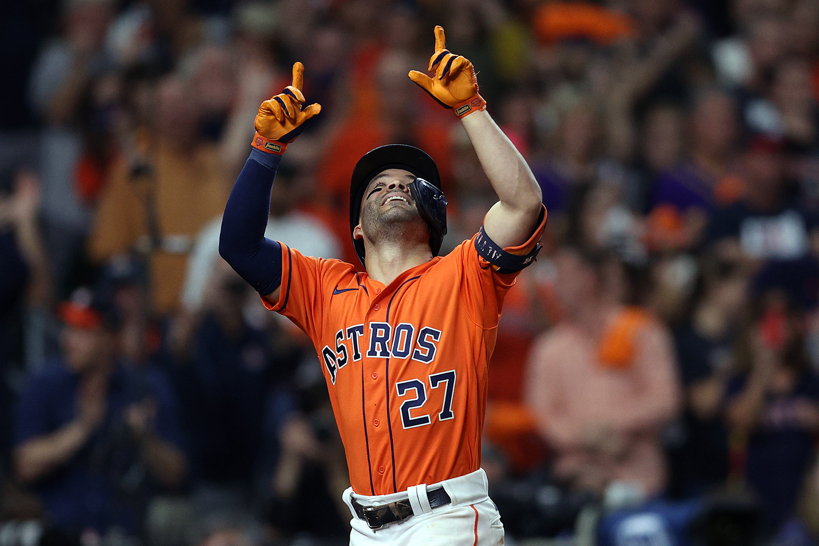 Jose Altuve of the Houston Astros celebrates after hitting a one run home run against the Atlanta Braves during the seventh inning.