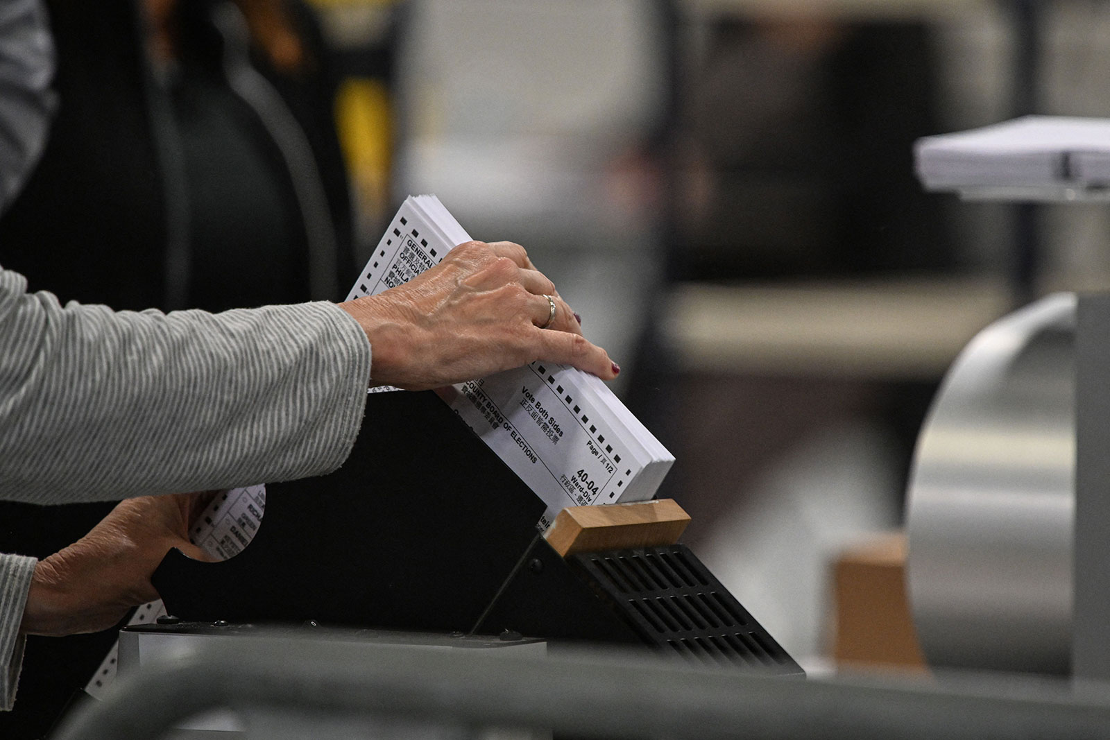 Poll workers process ballots at an elections warehouse outside of Philadelphia on November 8.