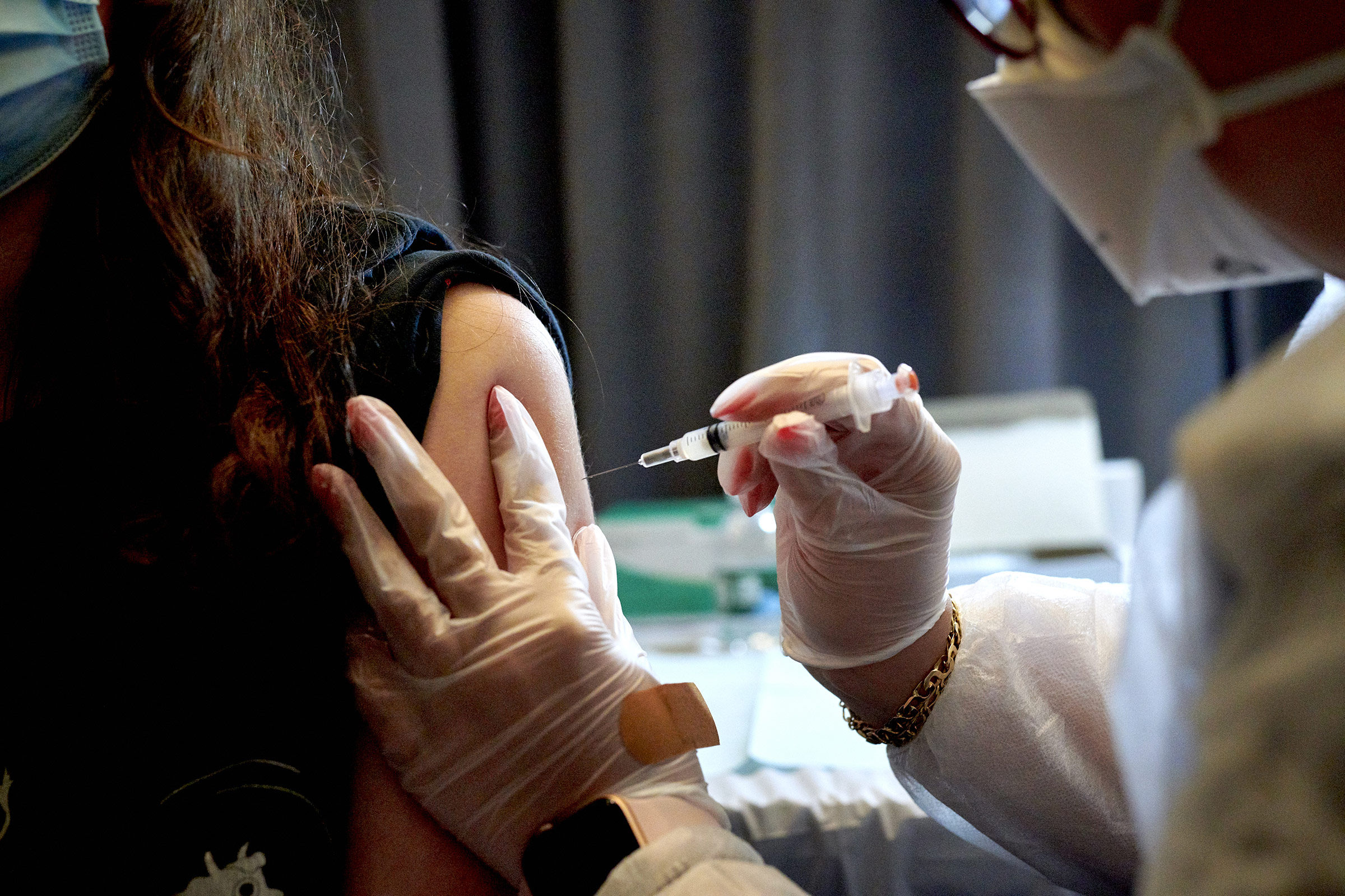 A healthcare worker administers the Moderna Covid-19 vaccine at the American Museum of Natural History vaccination site in New York, on Friday, April 30. 