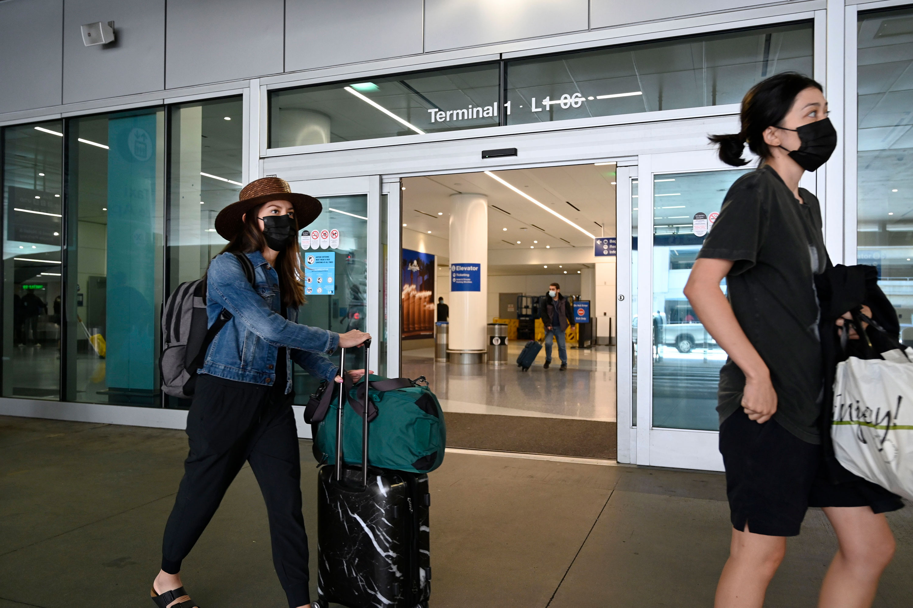 Travelers are seen at Los Angeles International Airport on Monday.