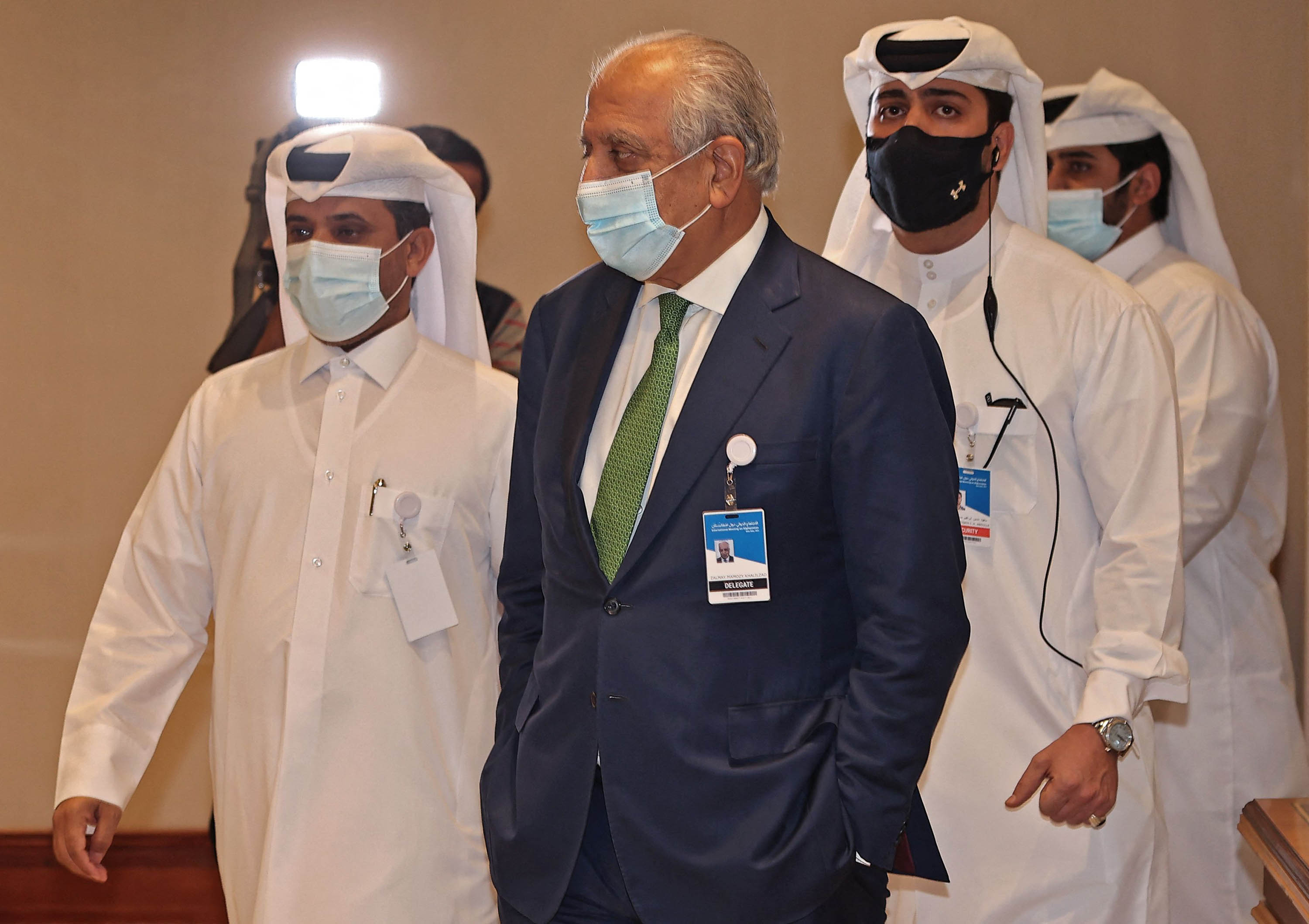 US special envoy for Afghanistan Zalmay Khalilzad, center, is seen at a hotel in Doha, Qatar, during an international meeting on the escalating conflict in Afghanistan, on August 12. 