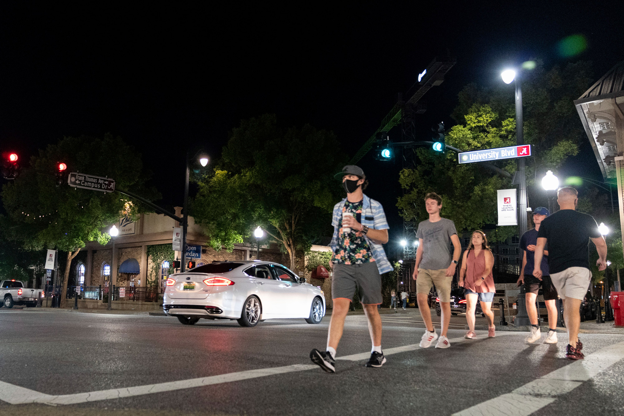 People make their way along The Strip, the University of Alabama's bar scene, on August 15 in Tuscaloosa, Alabama.