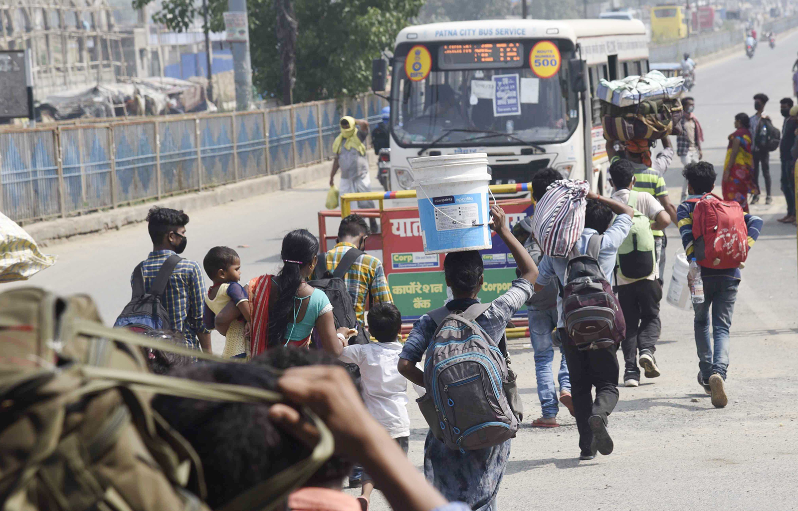 Migrants headed to their homes are seen walking along National Highway NH-30 in Patna, India, on May 18.