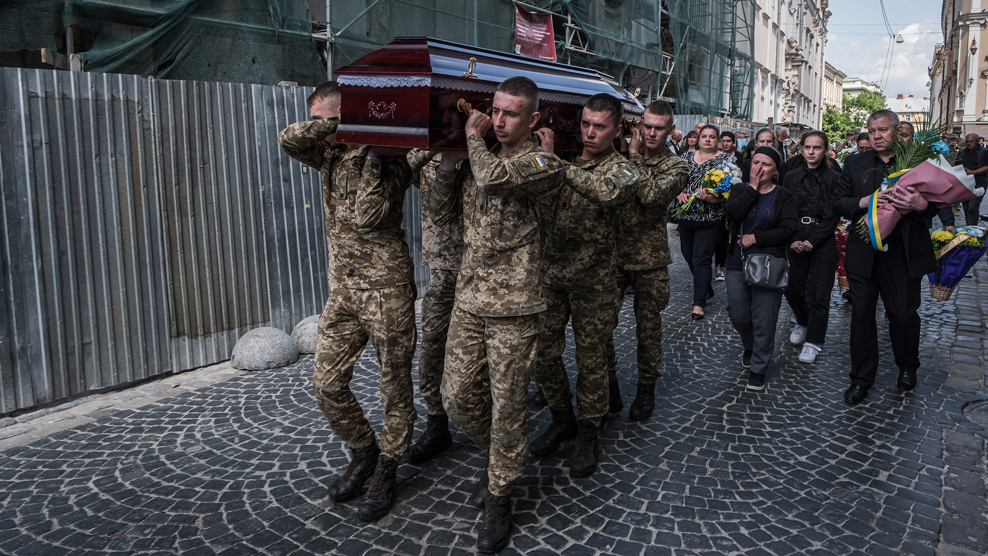Ukrainian soldiers carry the coffins of the fallen during the funeral in Lviv, Ukraine on May 26. 