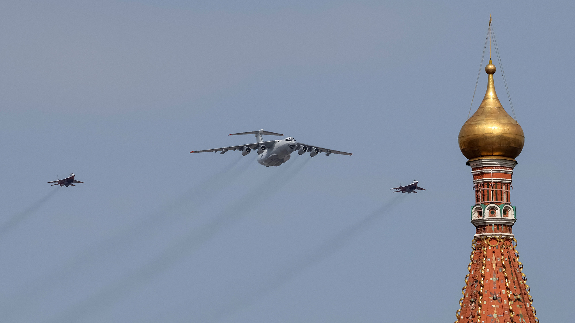 A Russian Il-78 military transport aircraft and MiG-29 fighter jets fly in formation during a rehearsal in Moscow on Saturday May 7.