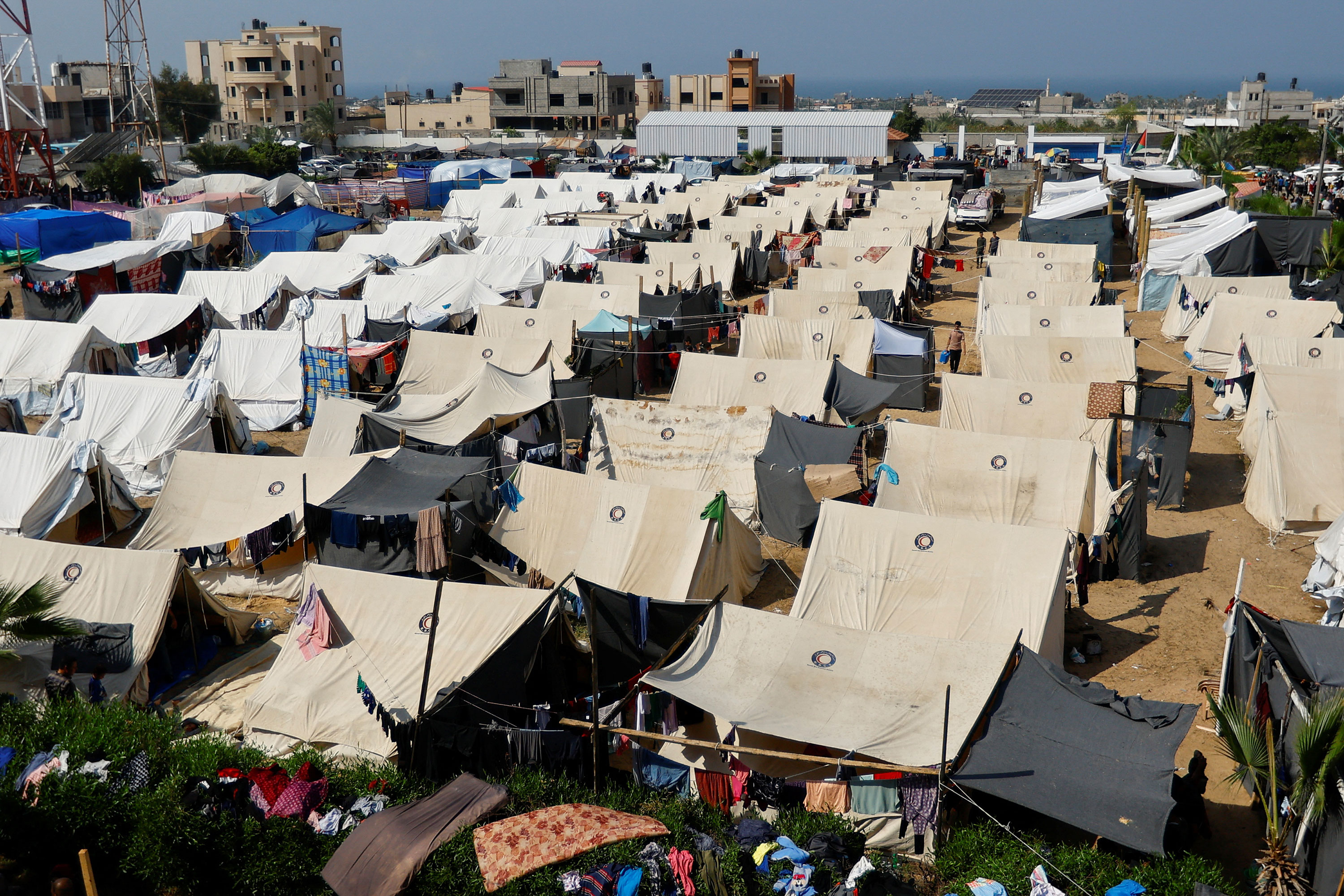 Palestinians take shelter in a tent camp at a United Nations-run center in Khan Younis, Gaza, on Monday.