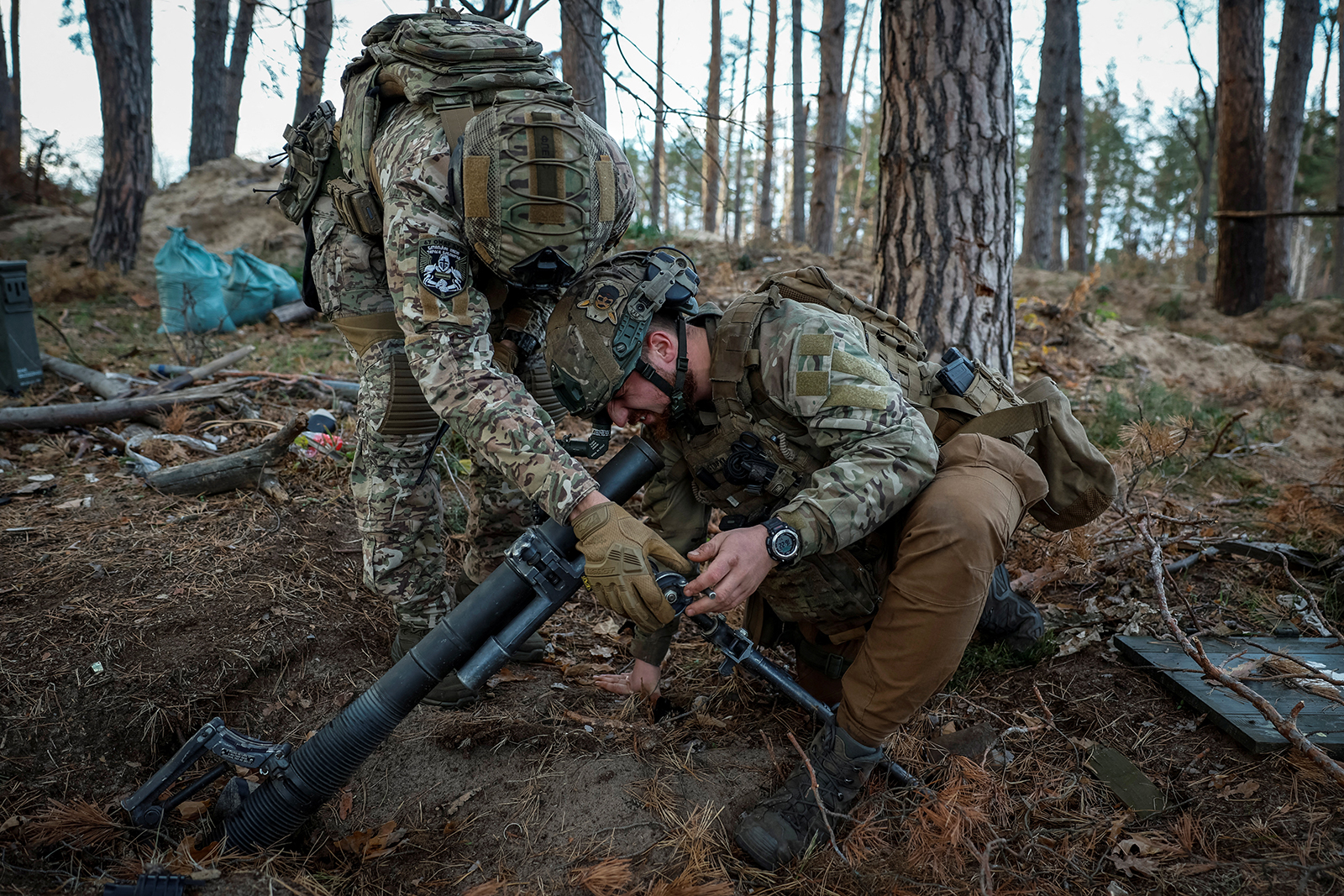 Ukraine servicemen prepare to fire a mortar near the frontline in Kreminna, Ukraine, on November 2, 2023. 