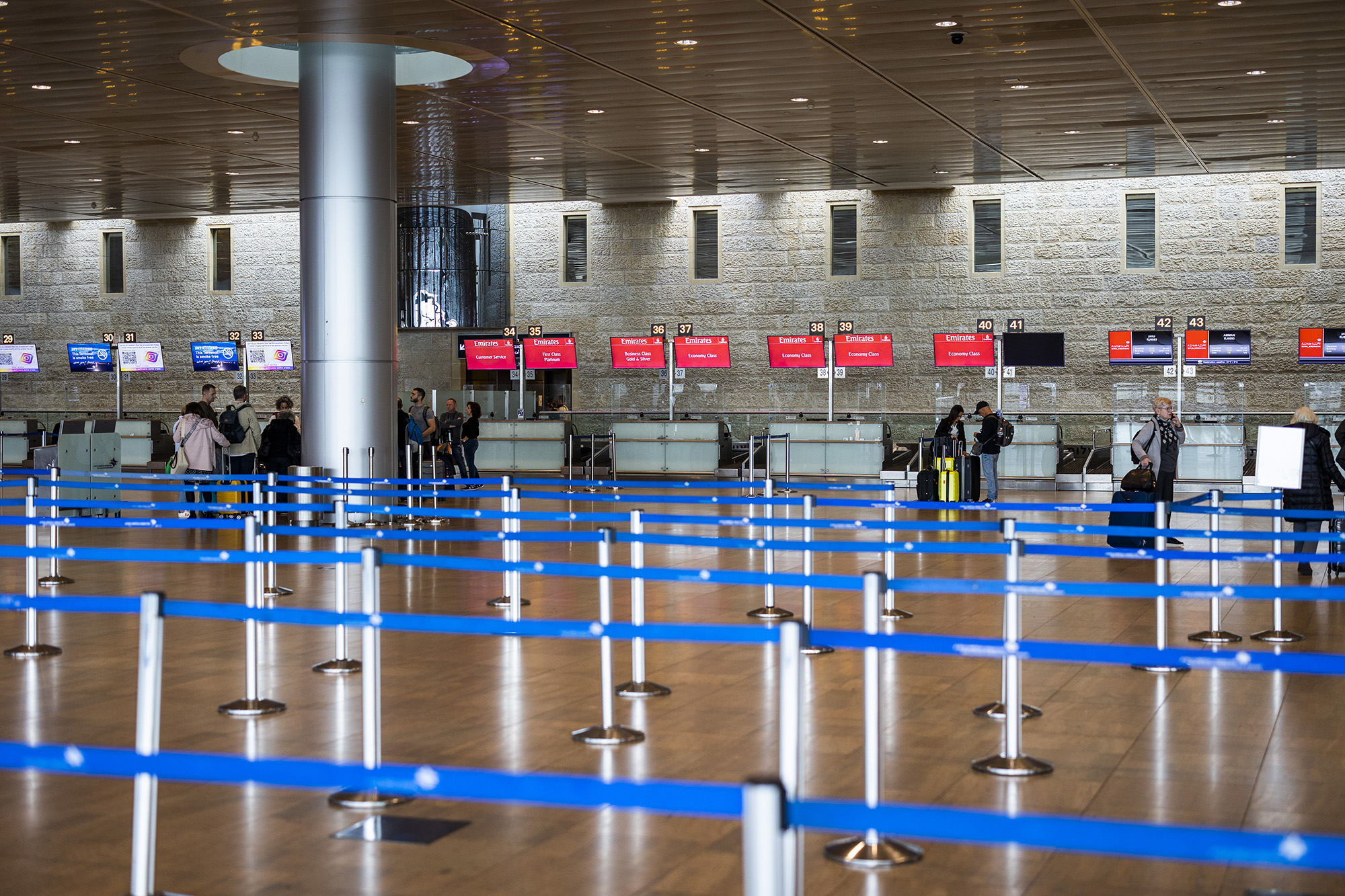 People stand at almost deserted ben Gurion airport during a national wide strike in Tel Aviv, Israel, on March 27.