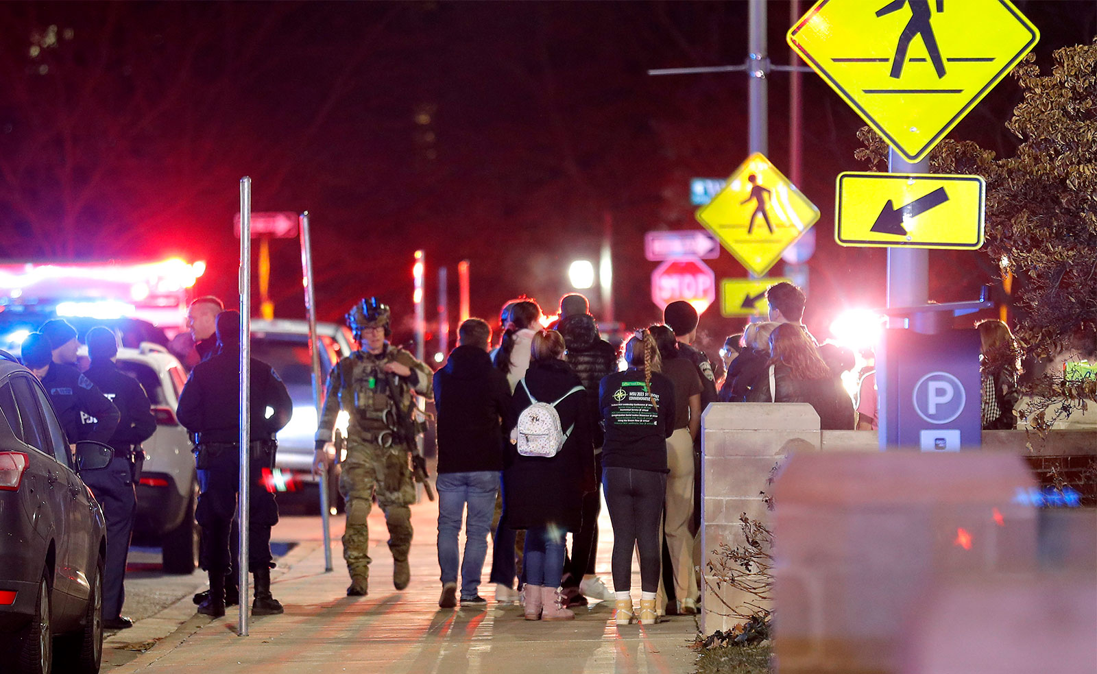 Students gather on the campus of Michigan State University after a shelter in place order was lifted early Tuesday. 