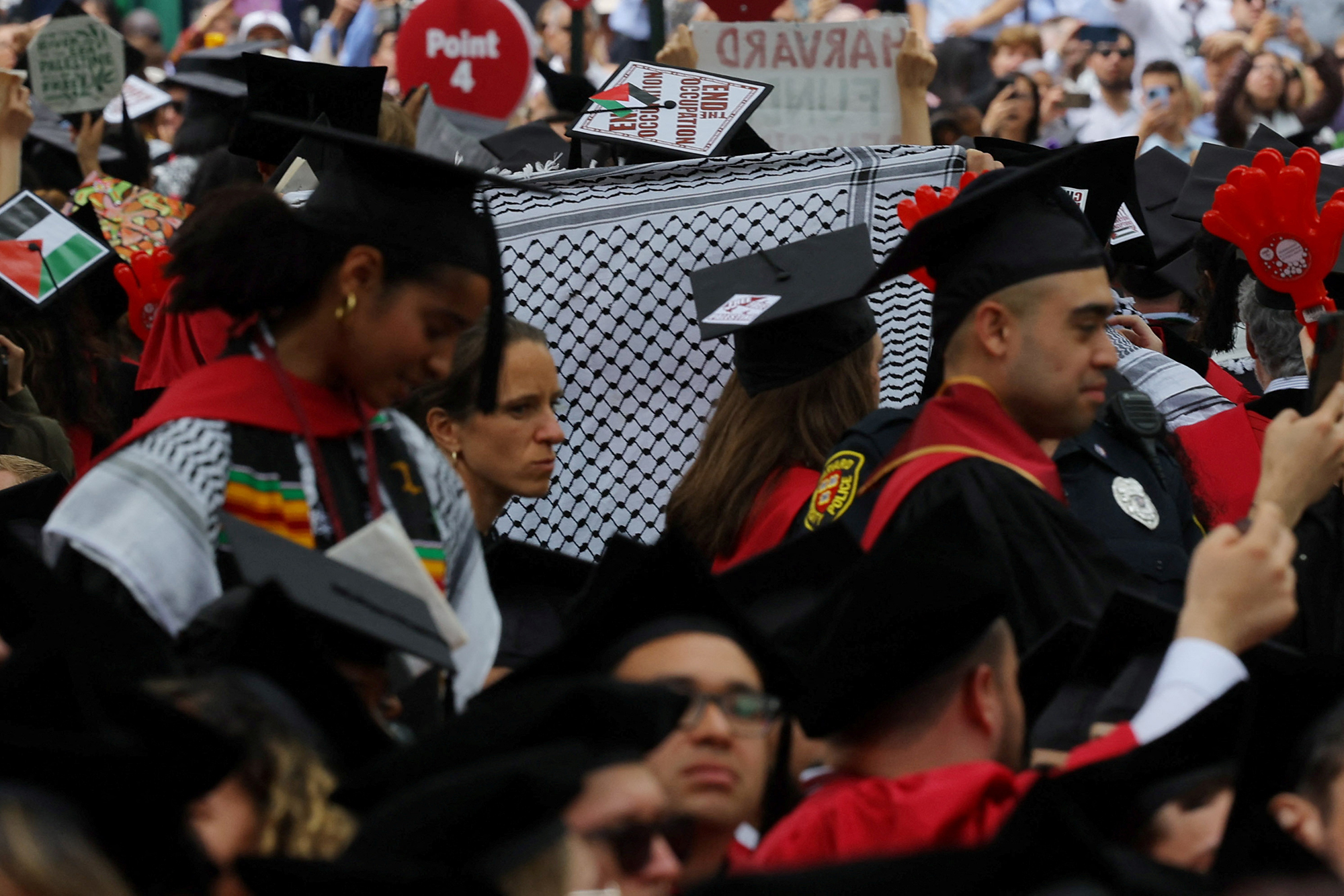 Graduating students walk out of the he 373rd Commencement Exercises at Harvard University in support of 13 students not able to graduate because of their participation in pro-Palestinian protests in Cambridge, Massachusetts, on May 23.