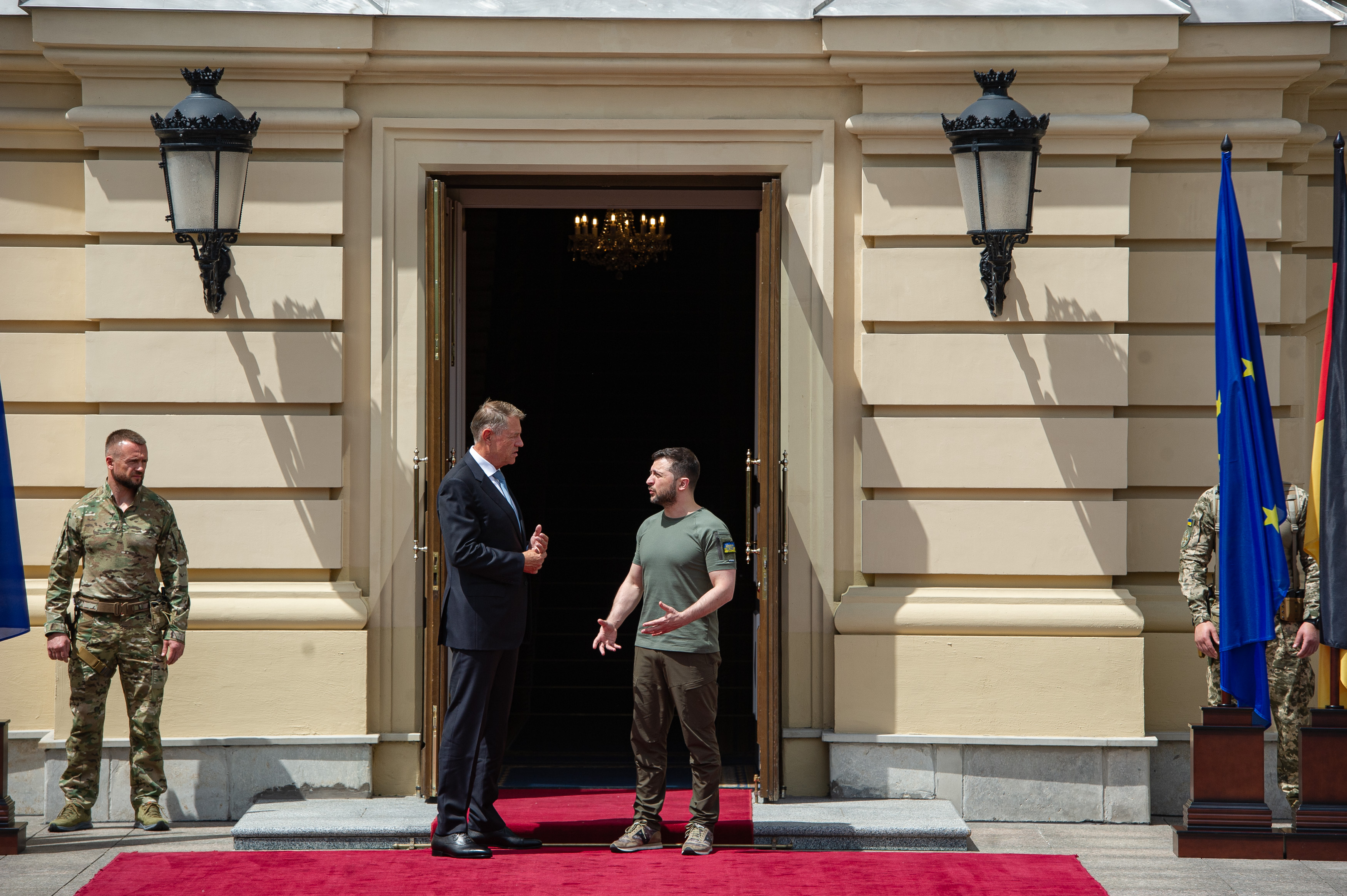 Ukrainian President Volodymyr Zelensky talks to Romanian President Klaus Iohannis on June 16 in Kyiv.
