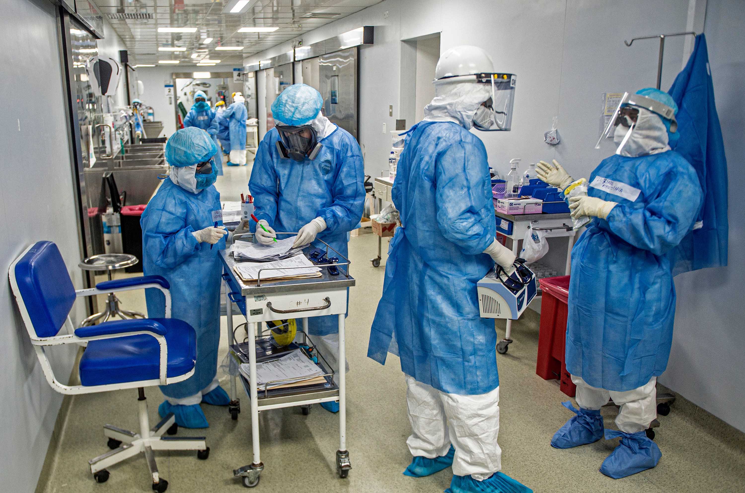 Health professionals are seen in the hall of the Intensive Care Unit of the Alberto Sabogal Sologuren Hospital, in Lima, Peru, on July 2.