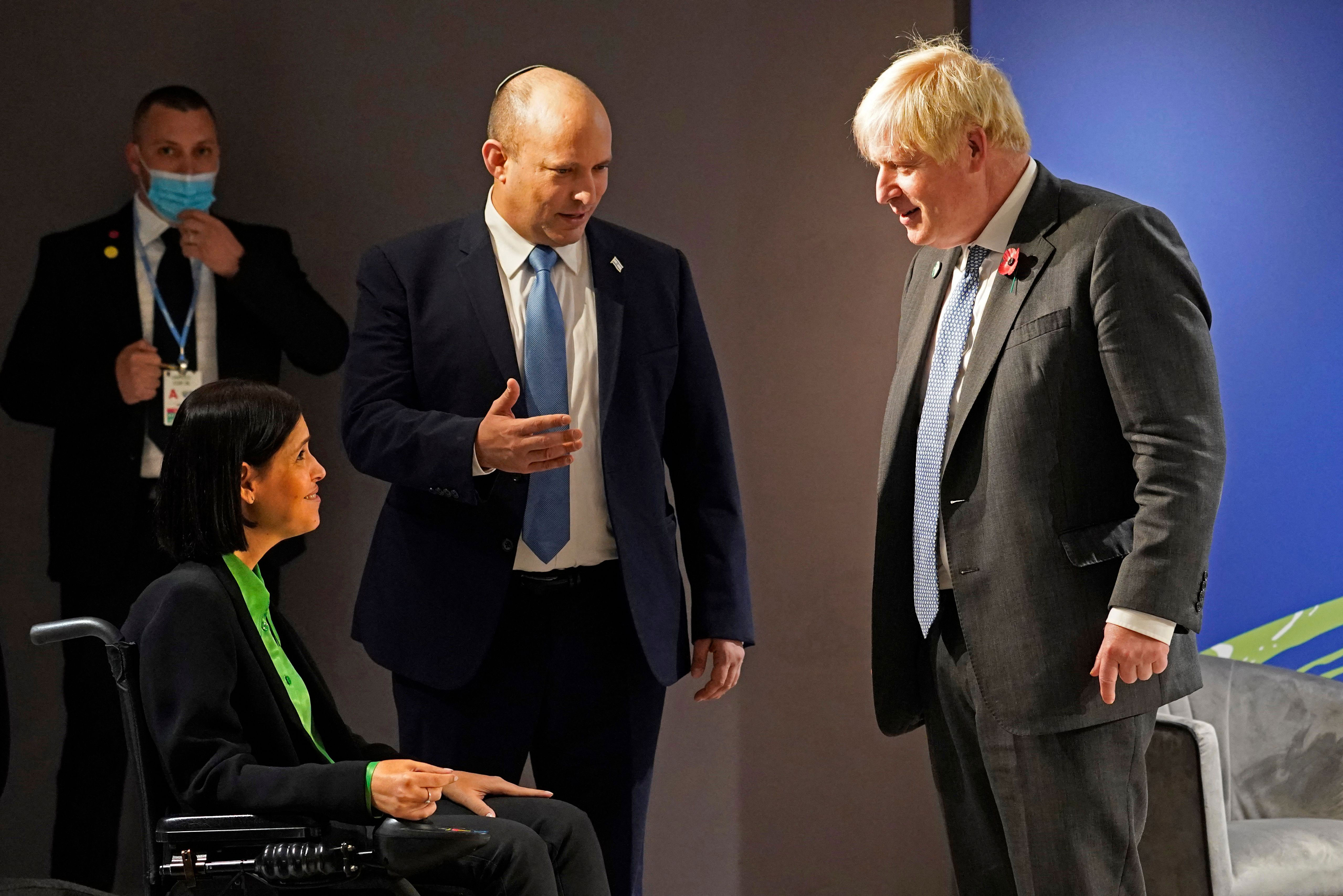 UK Prime Minister Boris Johnson, right, is introduced to Israel's Energy Minister Karine Elharrar during a meeting with Israel's Prime Minister Naftali Bennett, center, on the sidelines of COP26 in Glasgow, Scotland, on November 2.