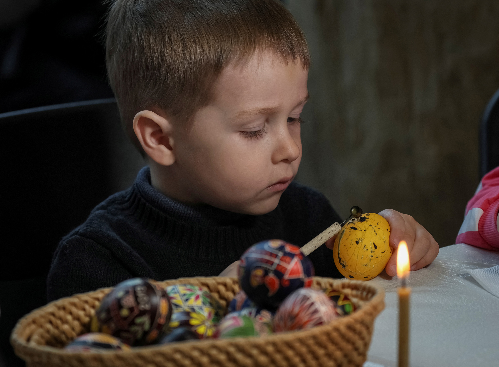 A boy paints an Easter egg in the traditional style during a lesson for children for the upcoming Easter holiday in Kyiv, Ukraine on April 22.