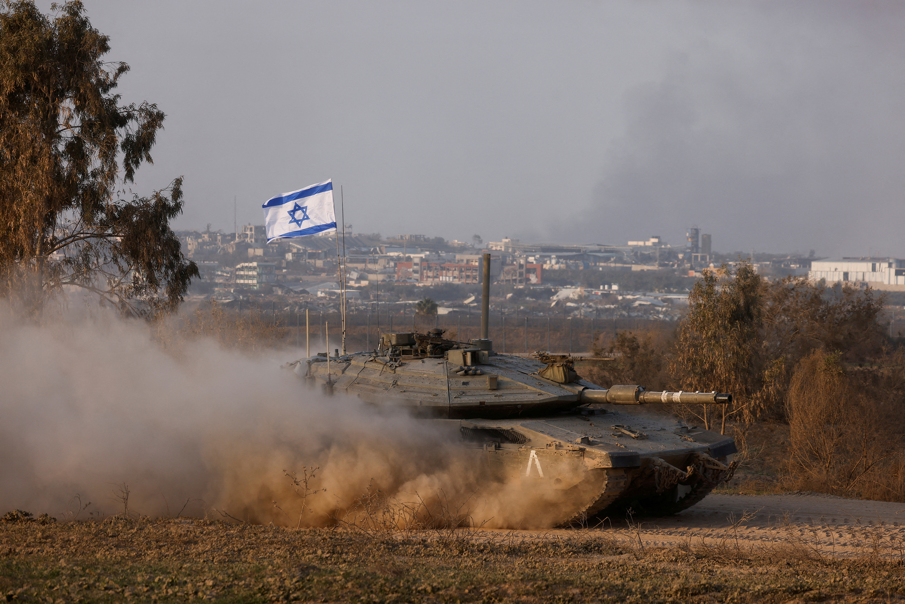 An Israeli tank operates in Israel, near the Gaza border, on December 30.