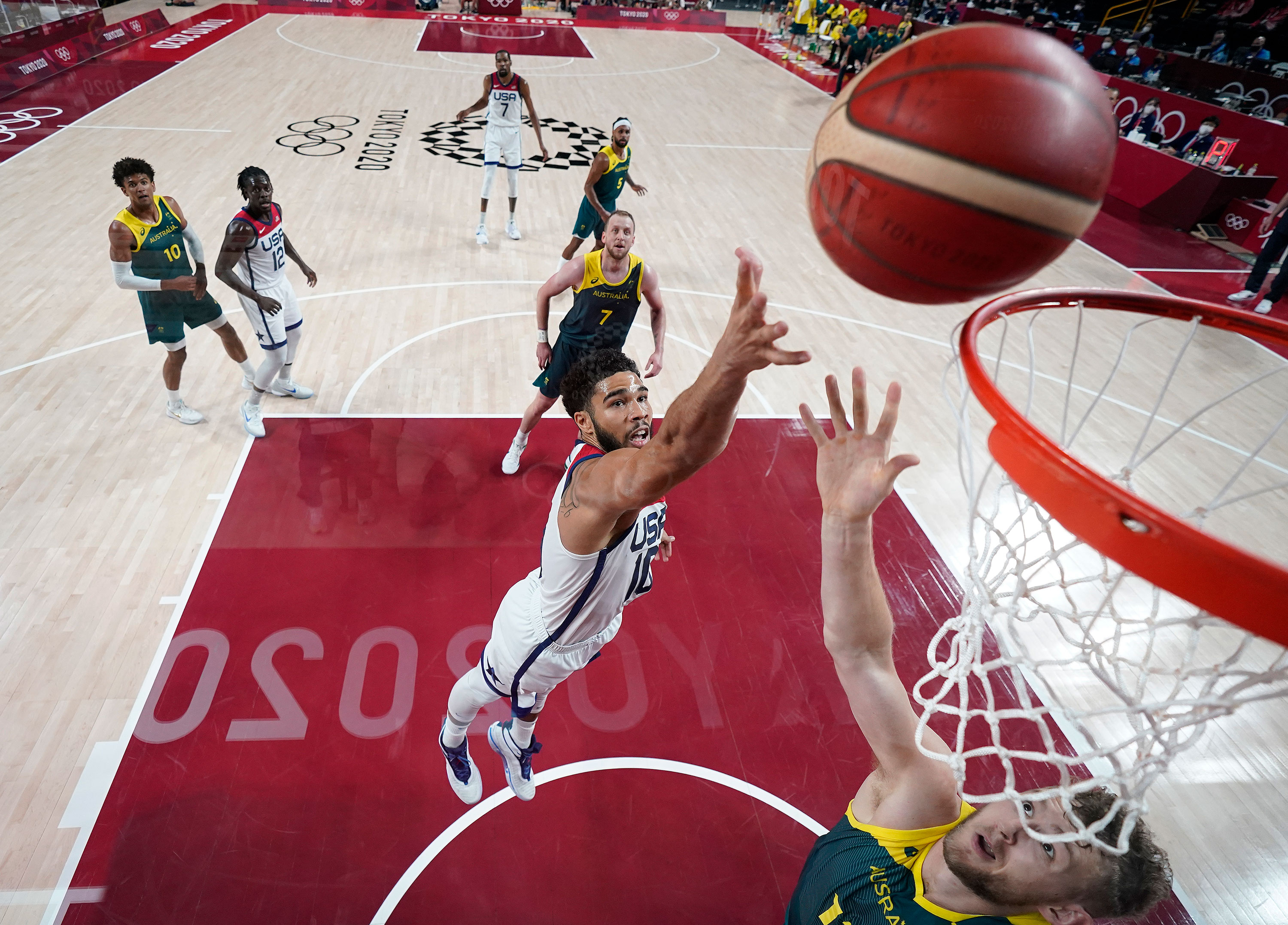 America's Jayson Tatum drives to the basket against Australia's Jock Landale during the first half of their quarterfinal basketball game on Thursday.