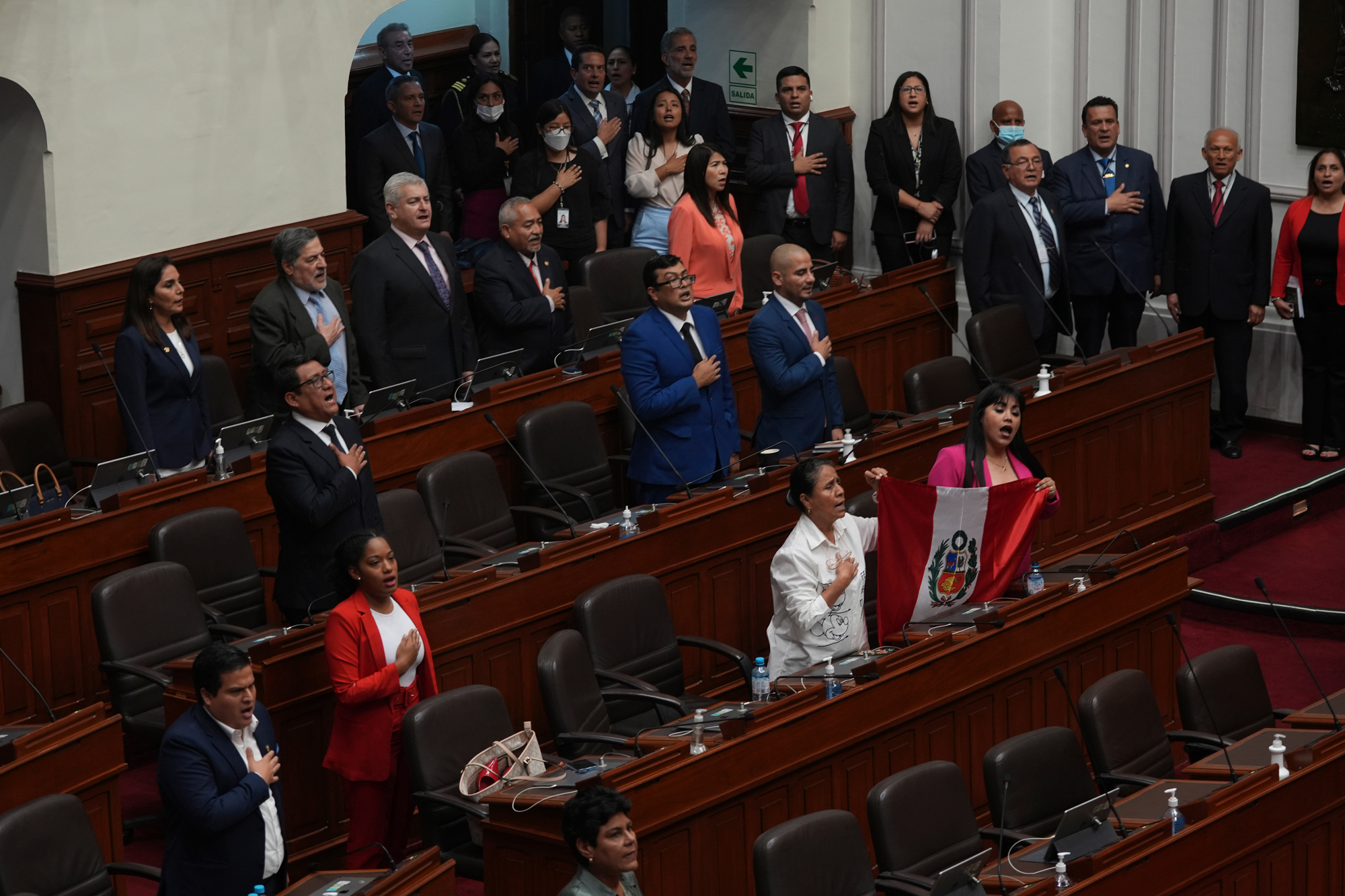 Lawmakers sing their national anthem inside Congress in Lima, Peru on Wednesday.