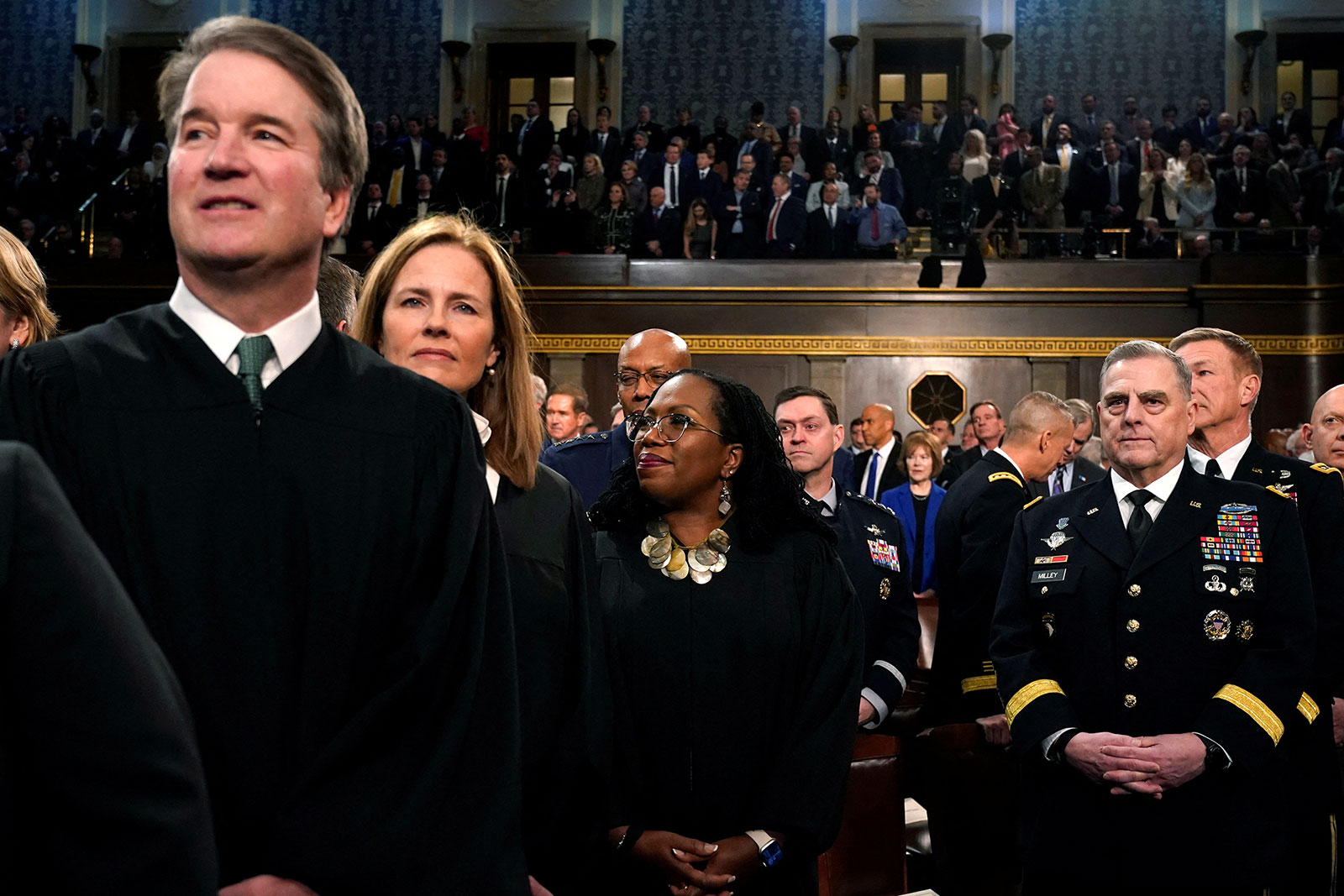 From left, Supreme Court Justices Brett Kavanaugh, Amy Coney Barrett and Ketanji Brown Jackson stand next to Chairman of the Joint Chiefs of Staff Gen. Mark Milley.