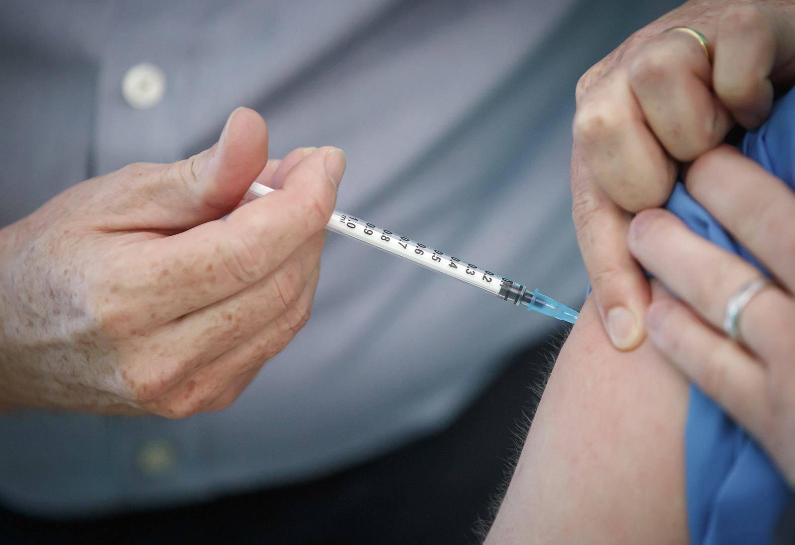 A person receives the Pfizer-BioNTech vaccine at a vaccination center in York, England on December 21, 2020.
