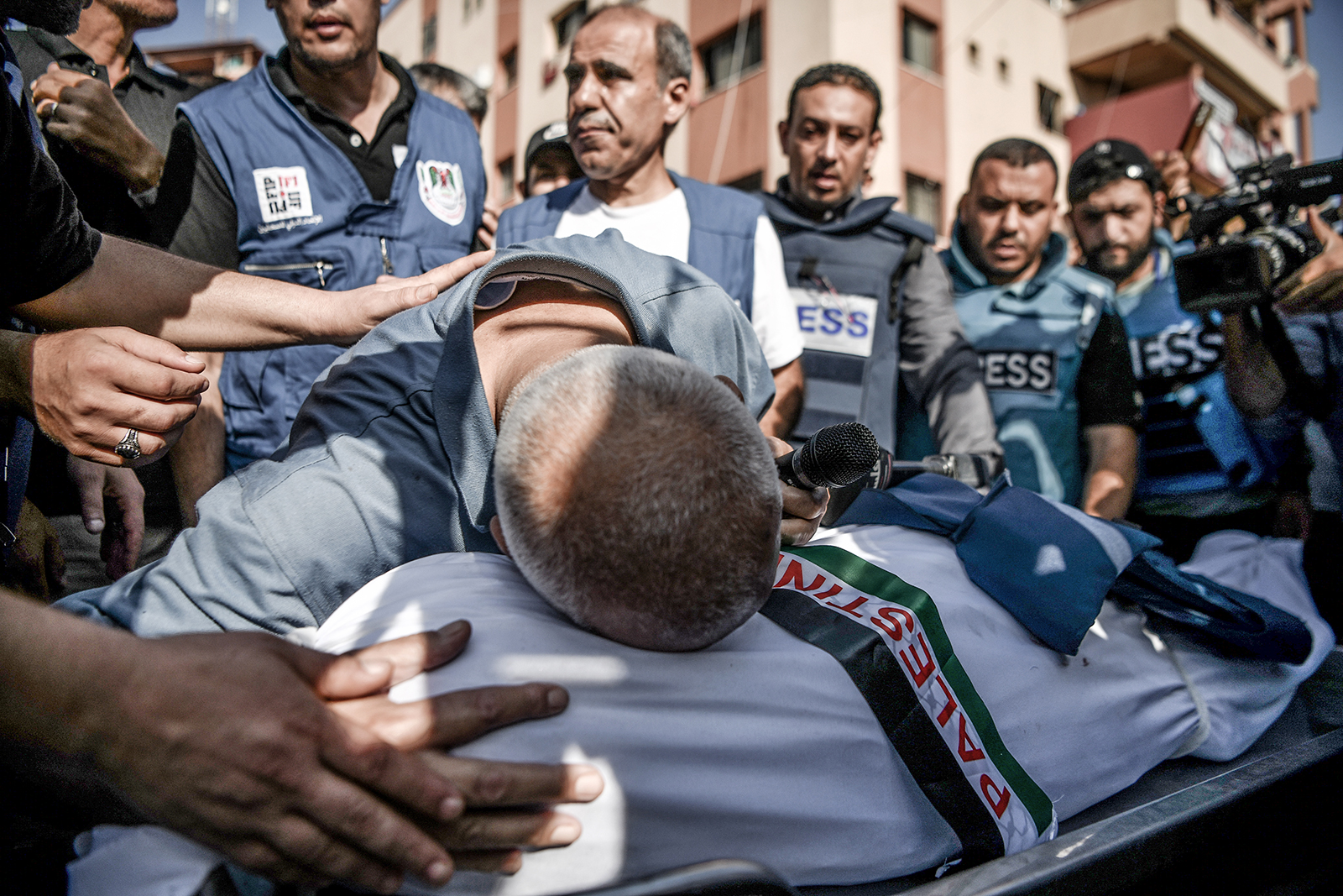 A relative bids farewell during the funerals of Palestine TV journalist Mohammad Abu Hattab and his 11 family members the day after they were killed in Khan Younis, Gaza on November 3. 