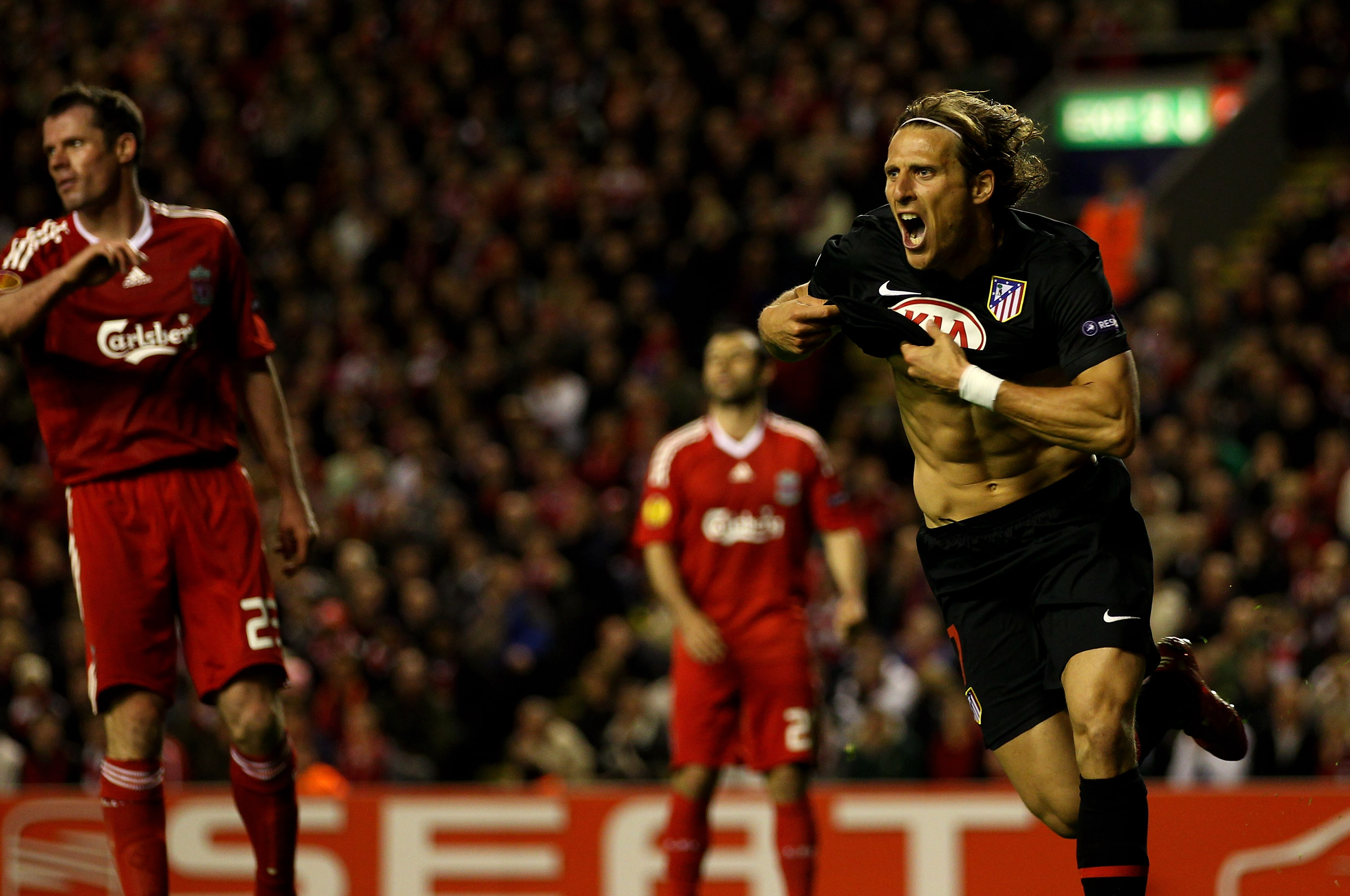 Diego Forlan celebrates his winning goal against Liverpool in 2010.