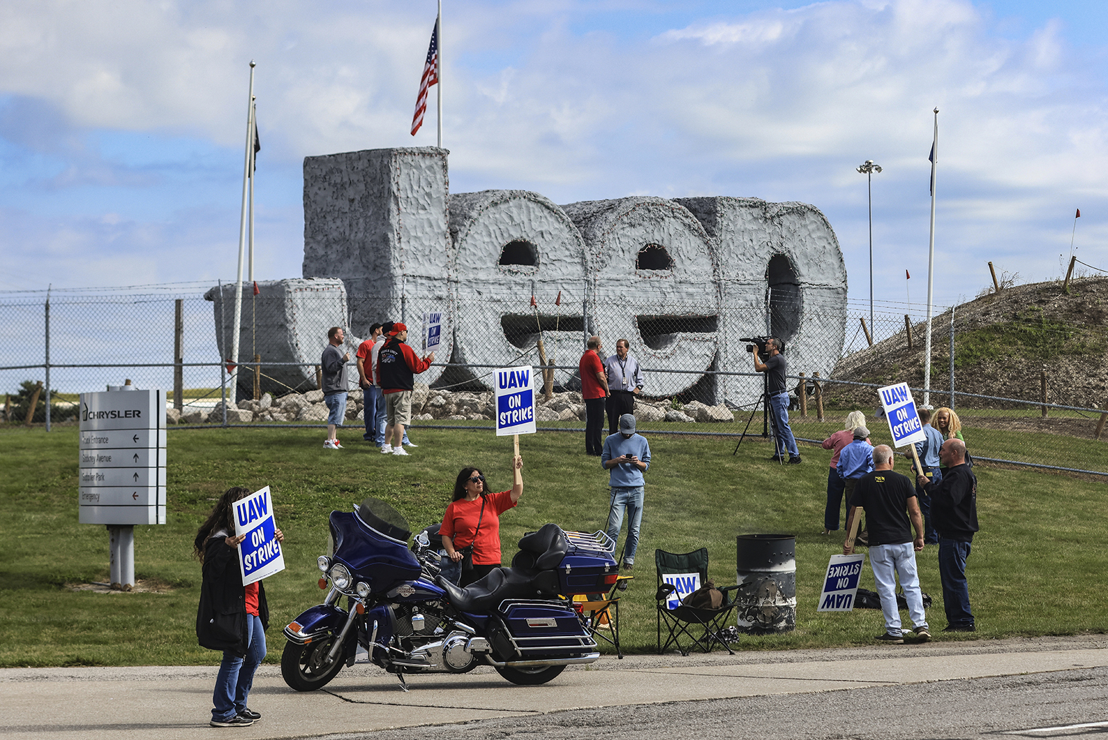 United Auto Workers hold signs while on strike this morning at the Stellantis Toledo Assembly Complex in Toledo, Ohio. 