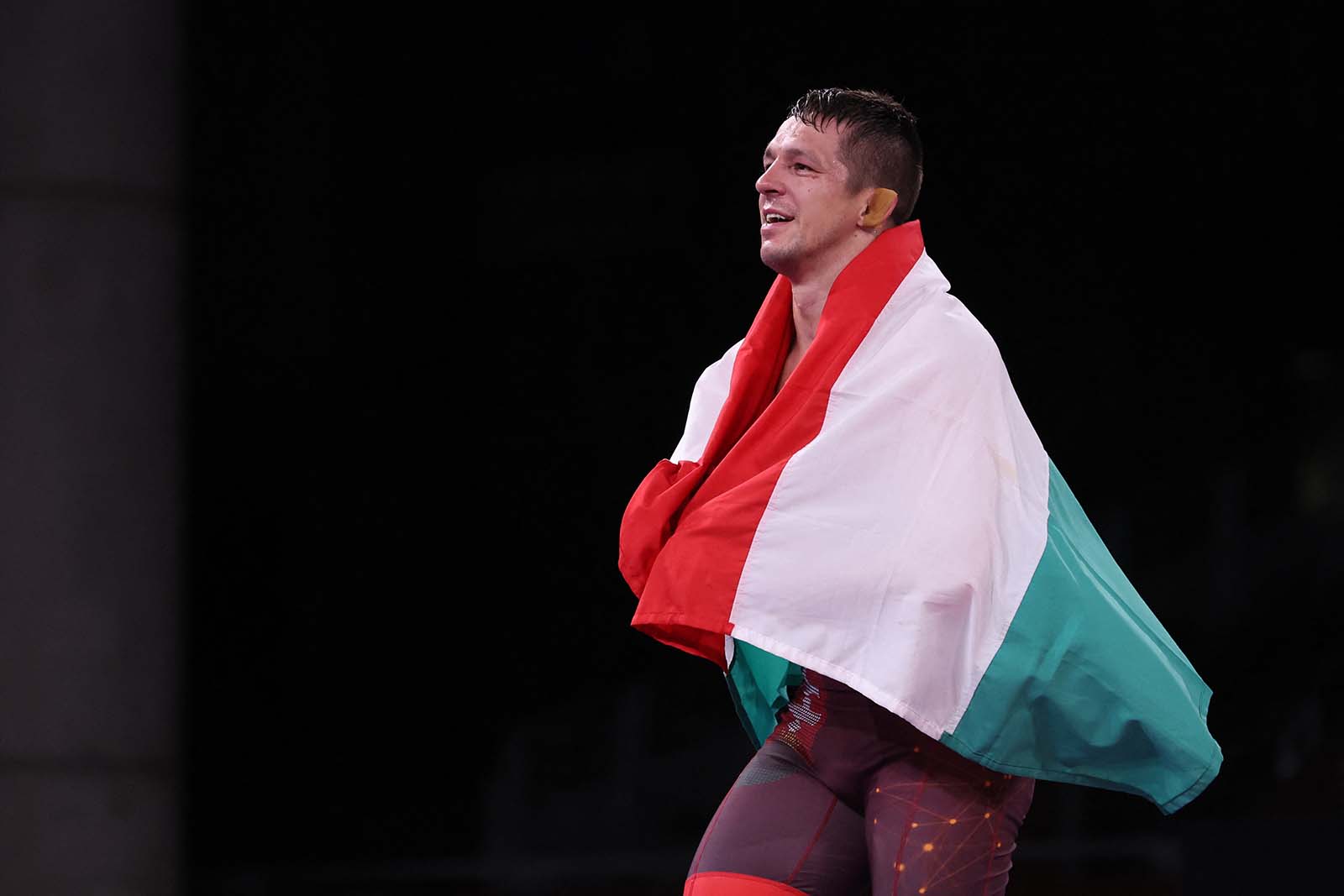 Hungary's Tamas Lorincz celebrates his gold medal victory against Kyrgyzstan's Akzhol Makhmudov in the men's Greco-Roman 77kg wrestling final match on August 3.