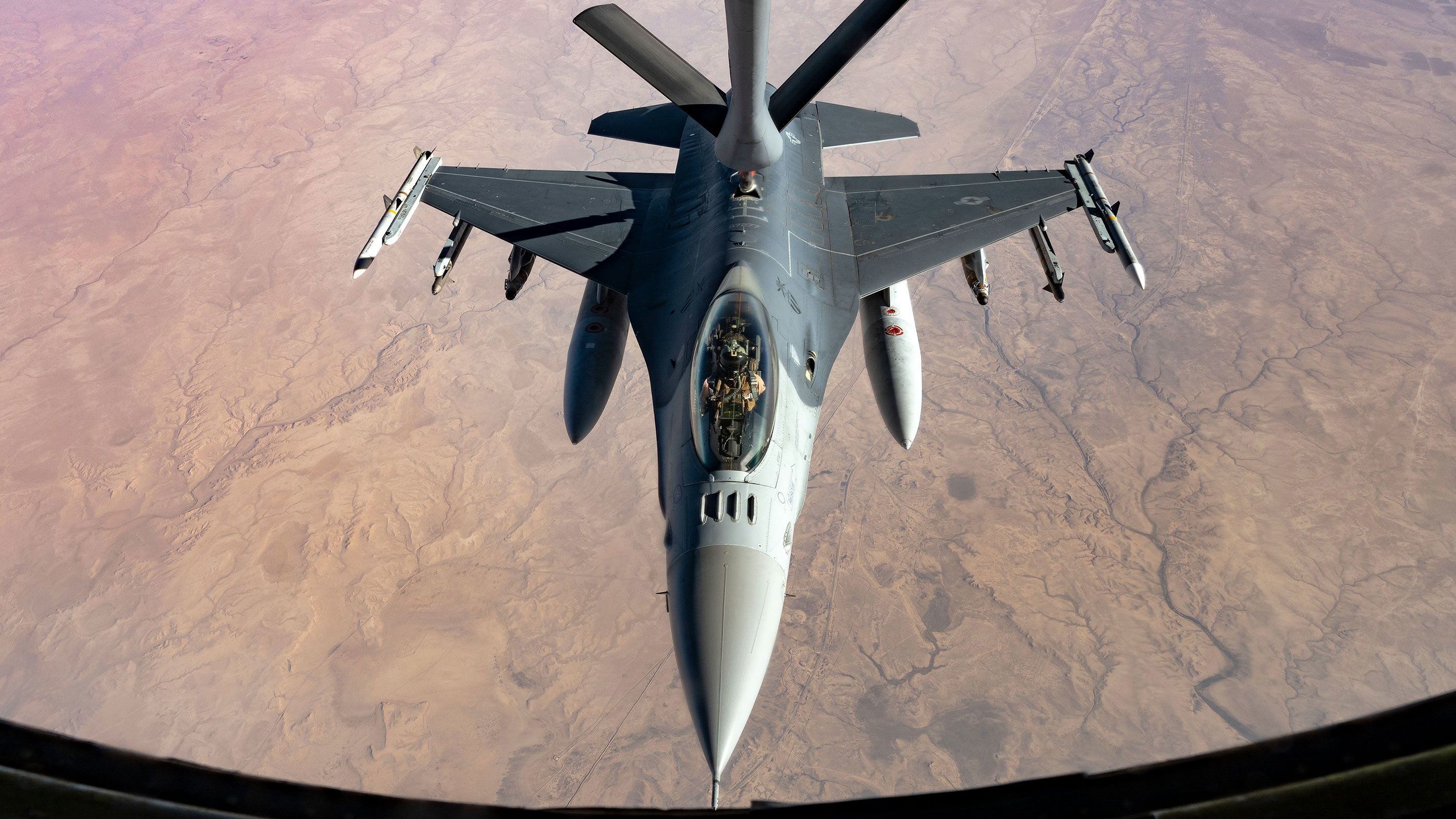 In this July 2021 photo, a US Air Force F-16 Fighting Falcon aircraft, assigned to the 121st Expeditionary Fighter Squadron, is refueled during a mission in support of Combined Joint Task Force – Operation Inherent Resolve in the US Central Command area of responsibility.