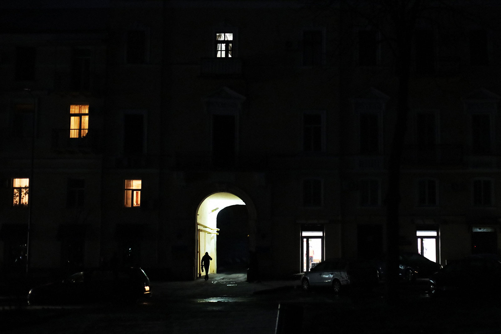 A man walks through an illuminated passageway during power outages in Odesa, Ukraine, on January 28. 