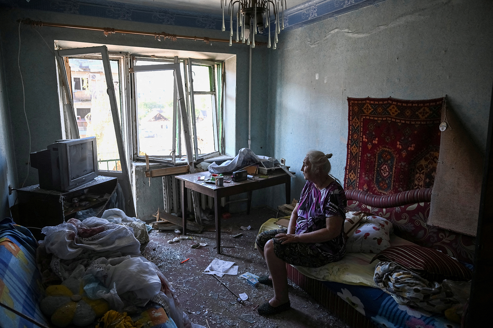 A woman sits in her flat at an apartment building destroyed during a Russian missile strike in Pokrovsk, Ukraine on August 8.
