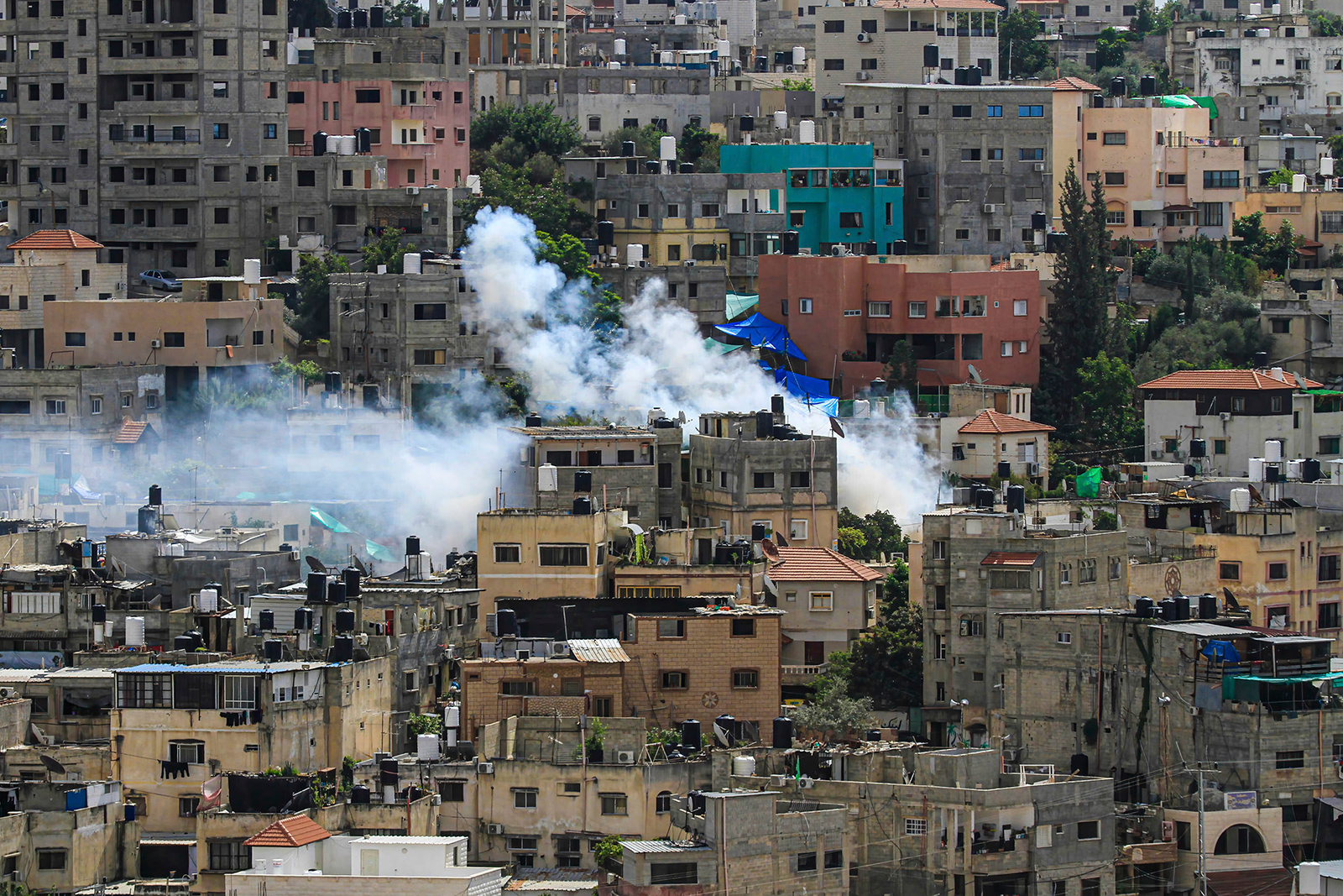 Heavy smoke is seen rising from several buildings in Nour Shams Palestinian refugee camp, near Tulkarm in the northern West Bank on October 19.