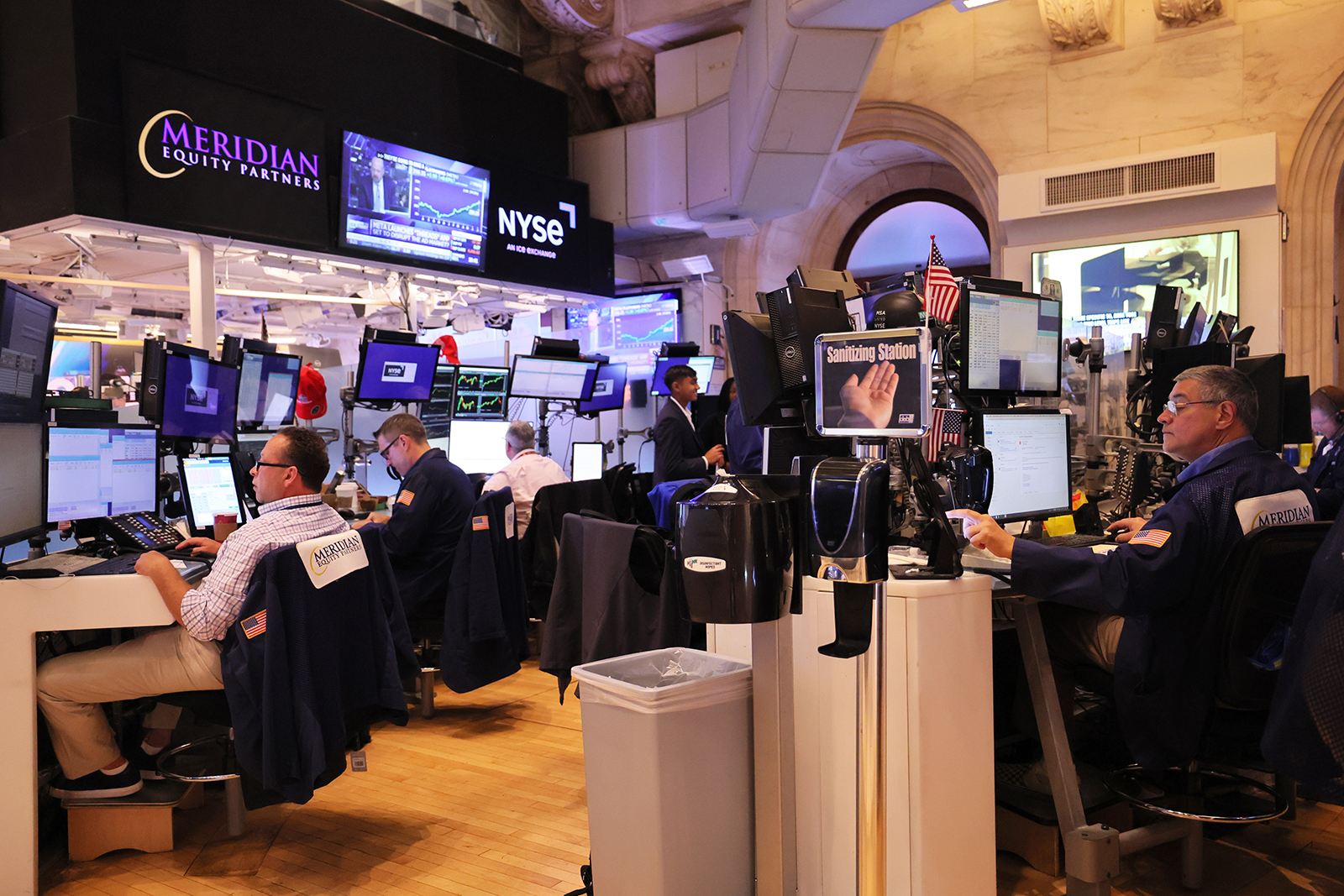 Traders work on the floor of the New York Stock Exchange during morning trading on July 6.