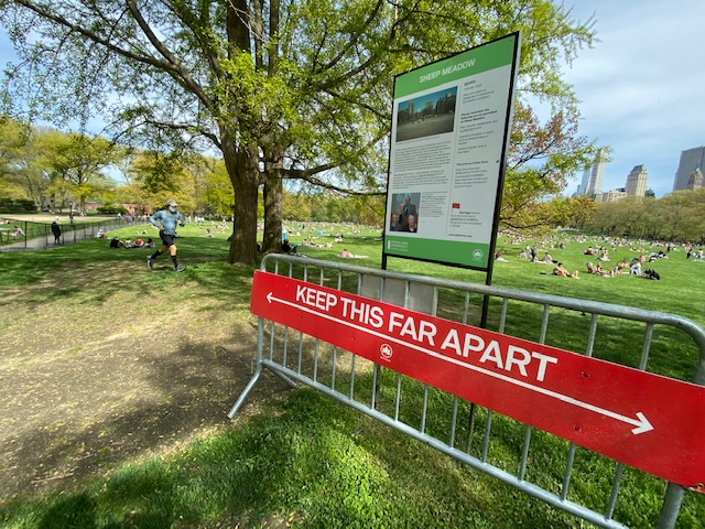 Signs encourage social distancing at Central Park in New York City.
