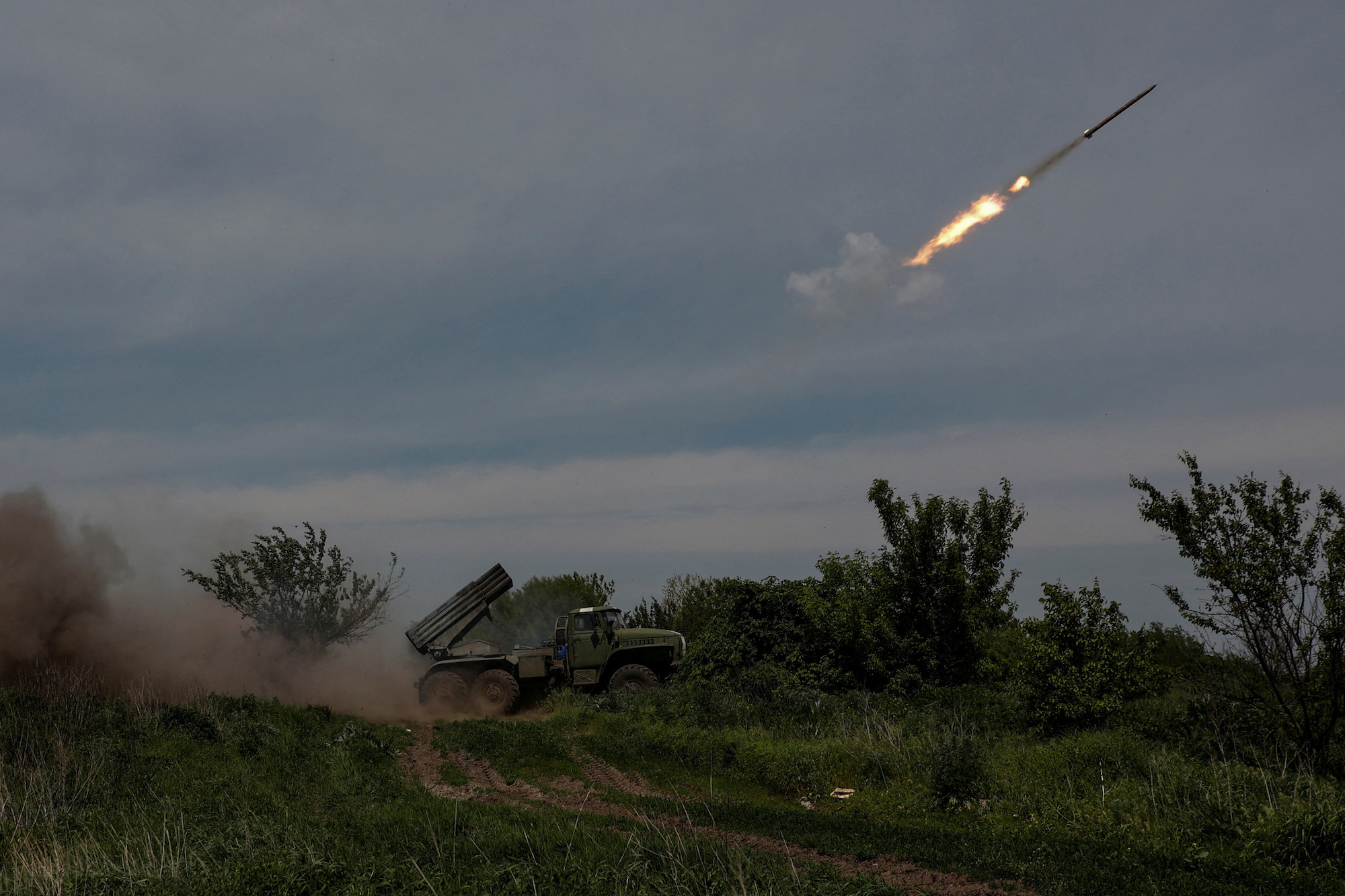 Ukrainian servicemen fire a rocket towards Russian troops near the frontline town of Bakhmut on Friday.