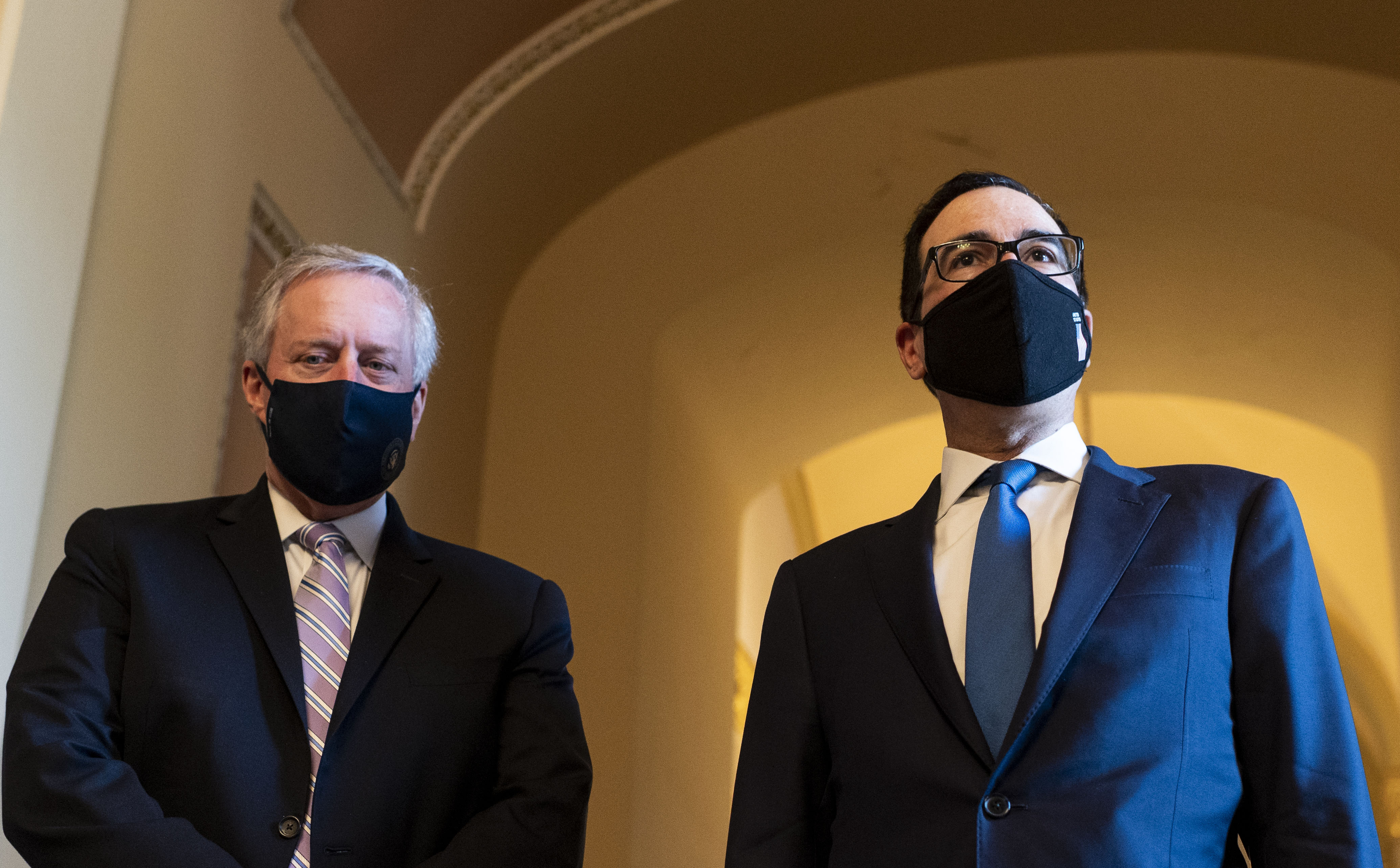 White House Chief of Staff Mark Meadows, left, and Treasury Secretary Steven Mnuchin speak to reporters as they leave a coronavirus aid meeting in Washington, DC, on July 23.