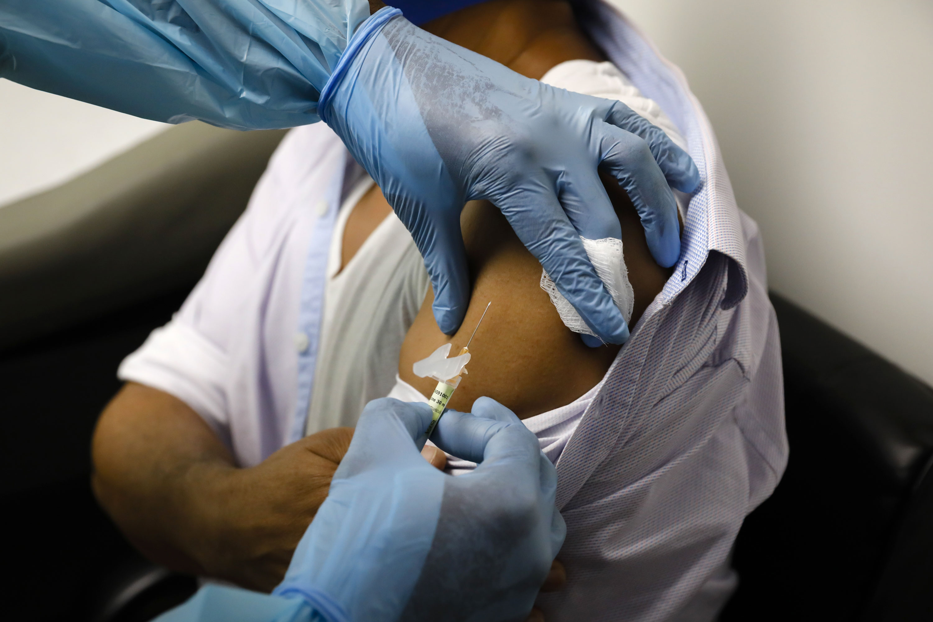 A health worker injects a person during Pfizer clinical trials for a Covid-19 vaccine in Hollywood, Florida, on September 9.