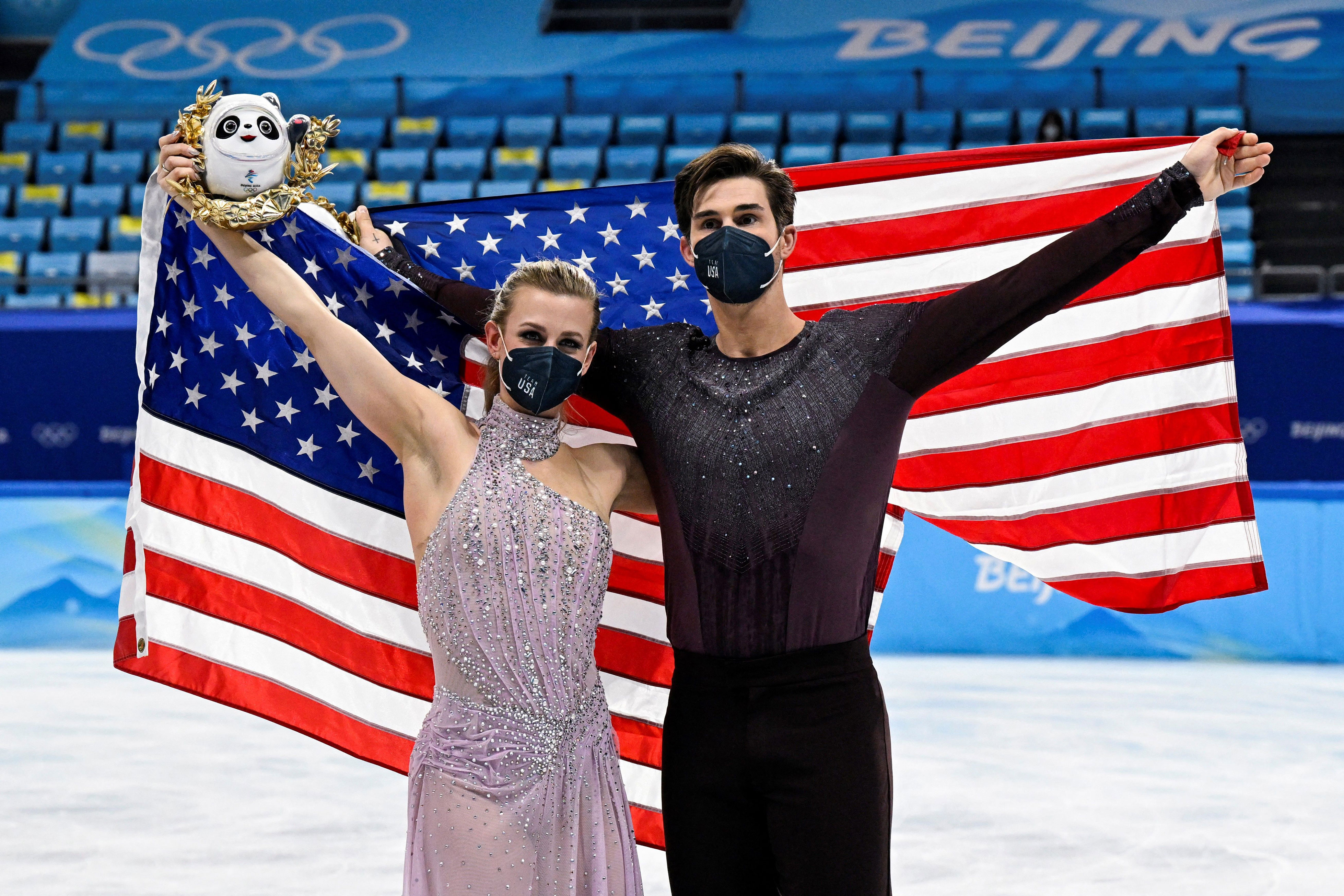Madison Hubbell and Zachary Donohue celebrate during the ice dance figure skating event on Monday.