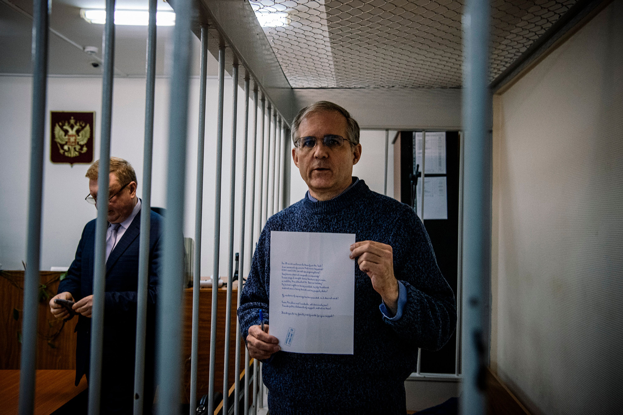 Former US Marine Paul Whelan, detained in Russia on espionage charges, holds a message before a hearing at the Lefortovo Court in Moscow, on October 24, 2019.