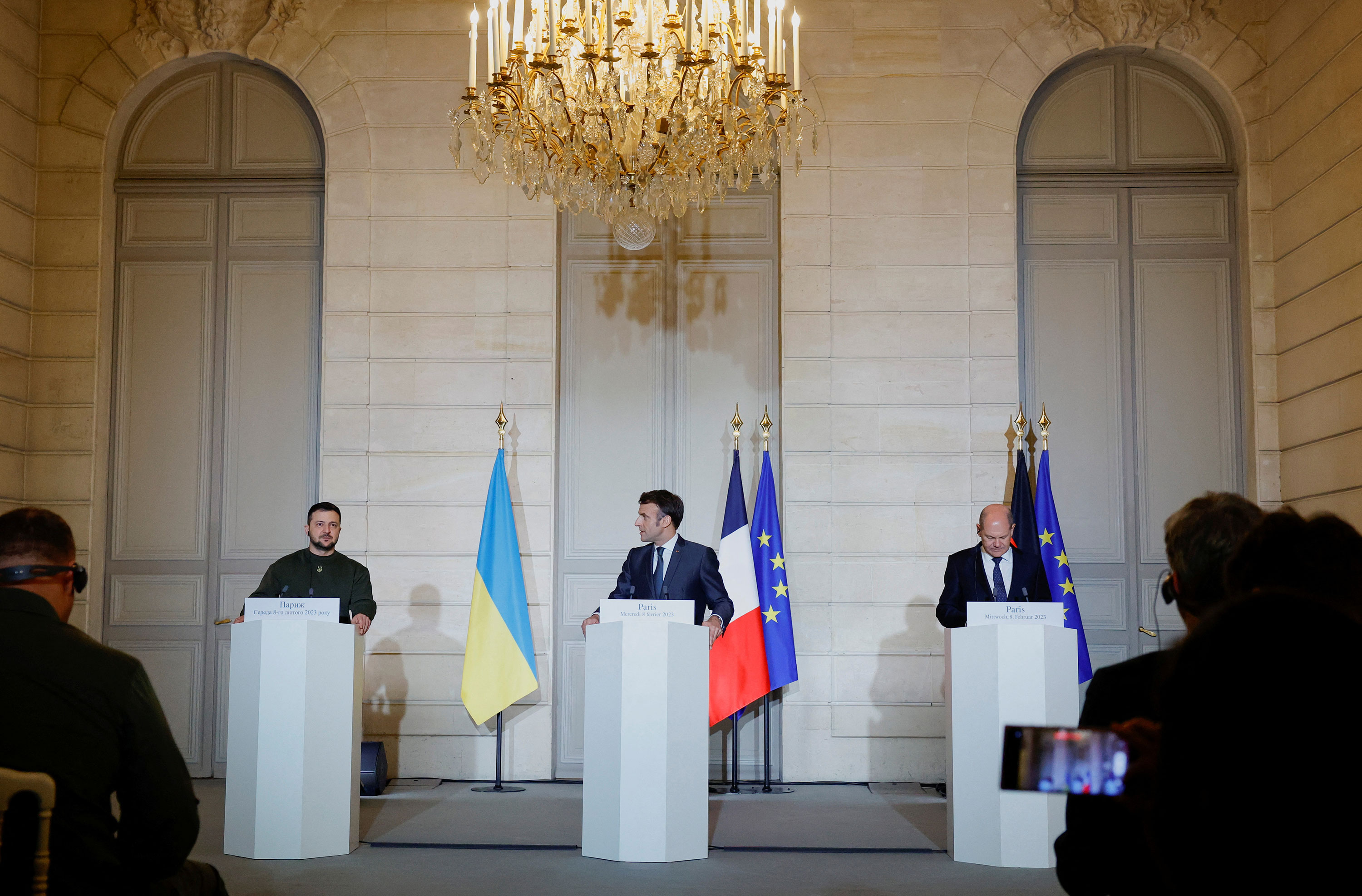 From left, Ukrainian President Volodymyr Zelensky, French President Emmanuel Macron and German Chancellor Olaf Scholz attend a joint statement at the Elysee Palace in Paris on February 8.