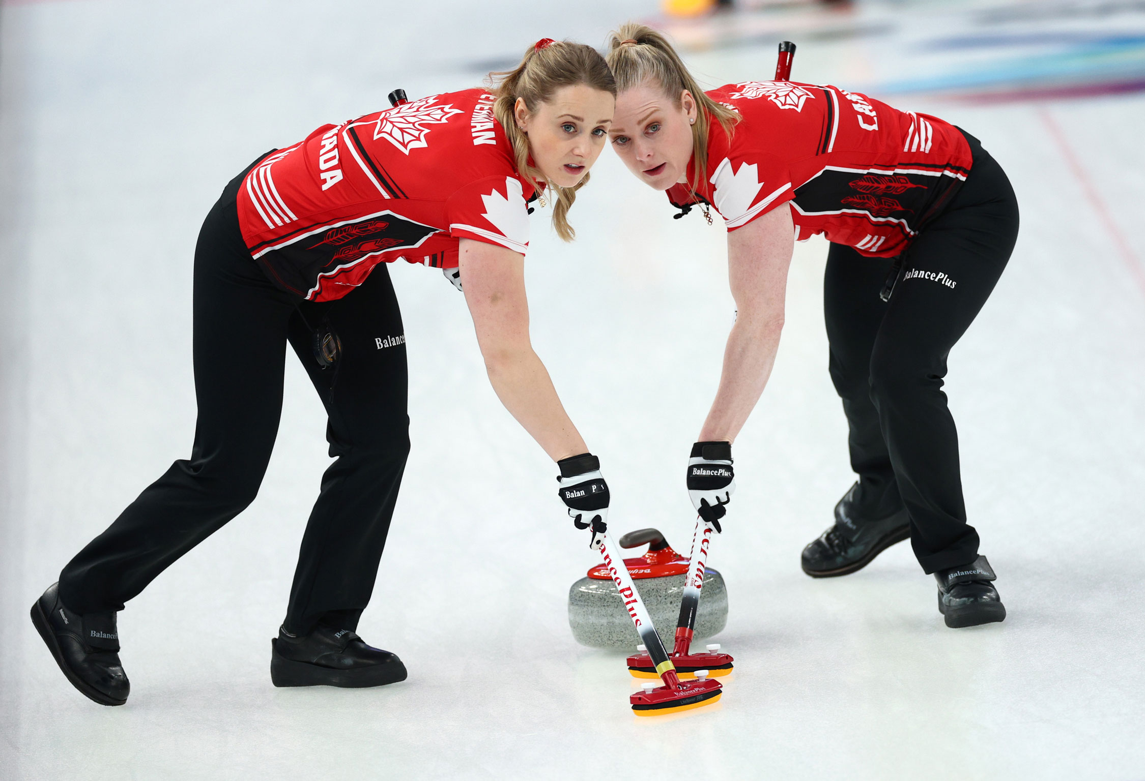 Jocelyn Peterman and Dawn McEwen of Canada compete in women’s curling on February 14.