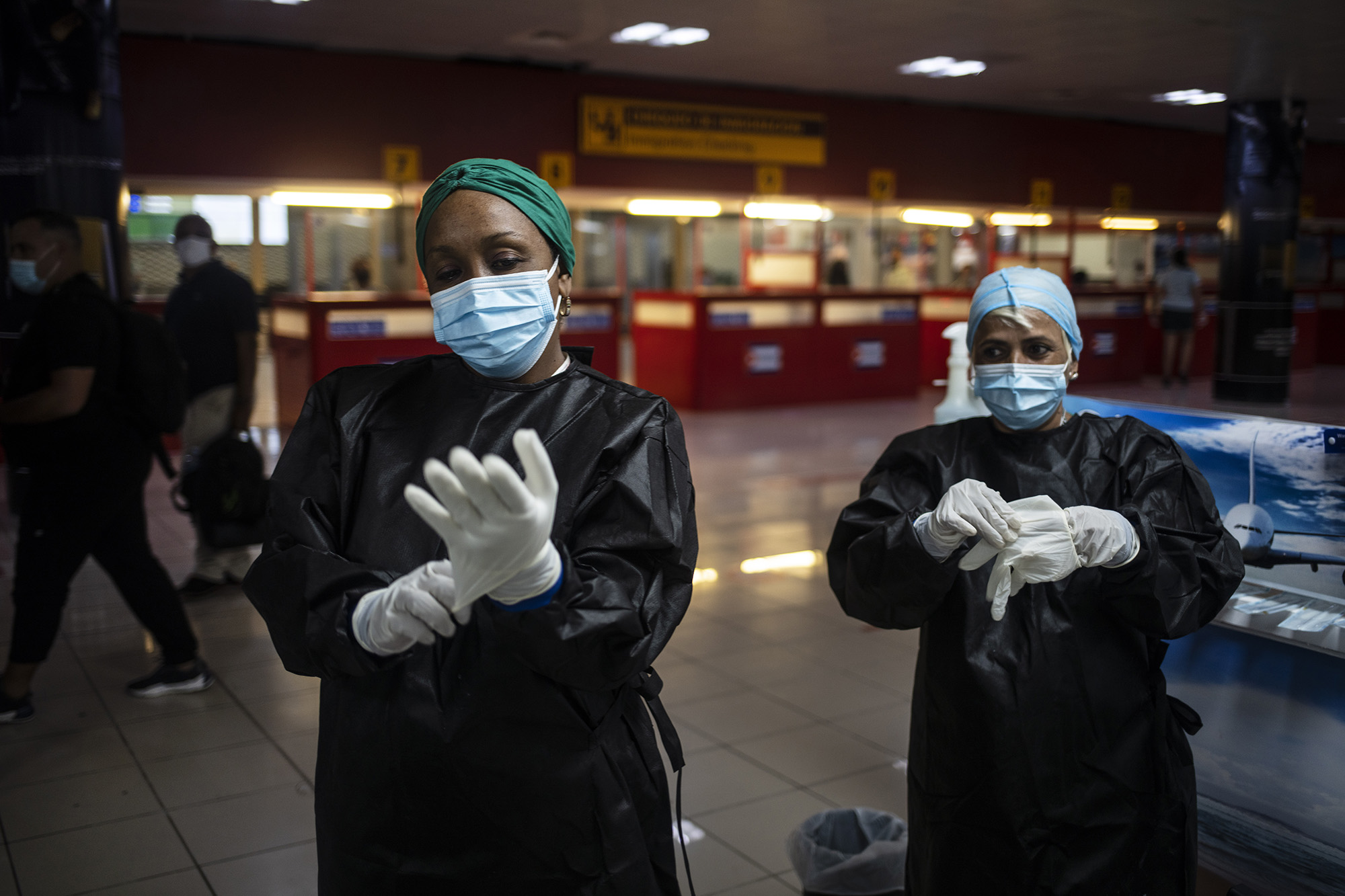 Health workers prepare to administer Covid-19 tests for passengers arriving from Mexico at the Jose Marti International Airport in Havana, Cuba, on November 15, 2020. 